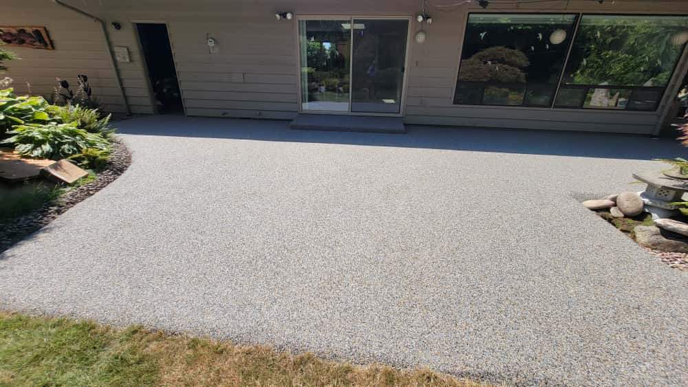 Monticello Sanctuary: A Patio of Refined Tranquility by Concrete Coating Experts Inc.