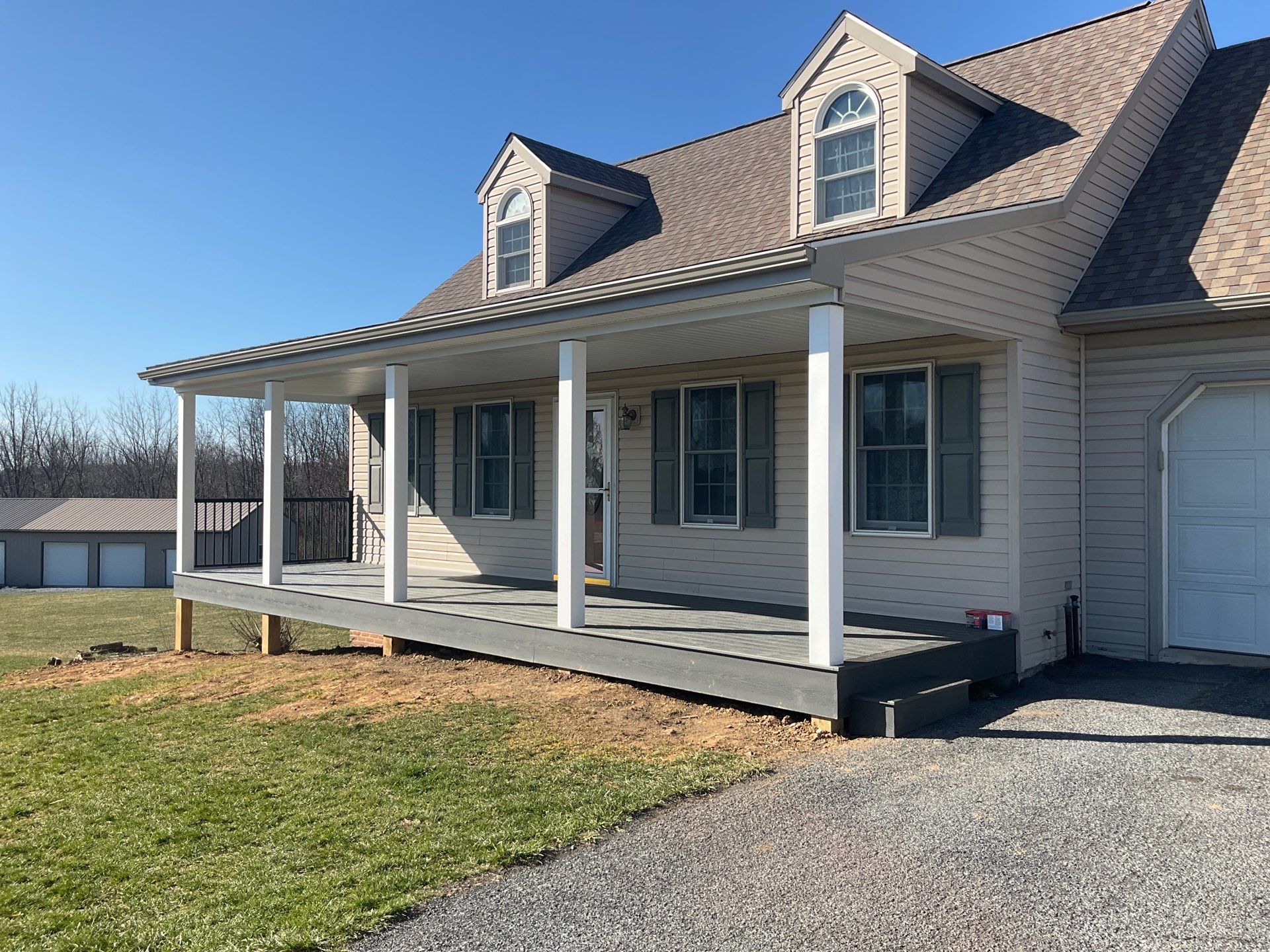 Custom Porch Roof Addition and Siding Renovation in Myerstown, PA by Esh Builders