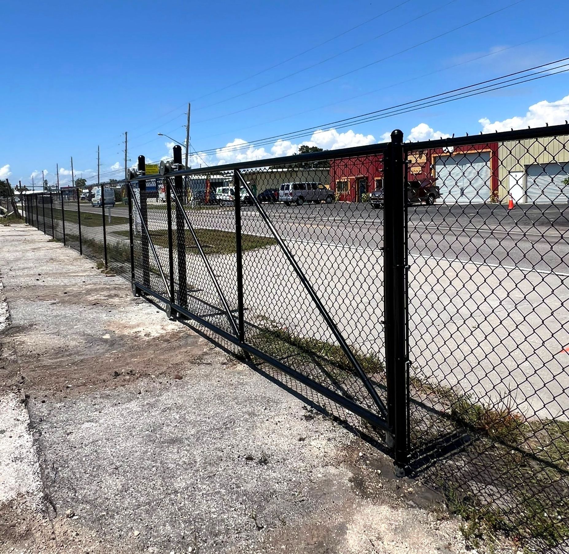 Chain-link Fence Installation using 6ft Black Chain Link Fence  by Asap fence and gates, LLC