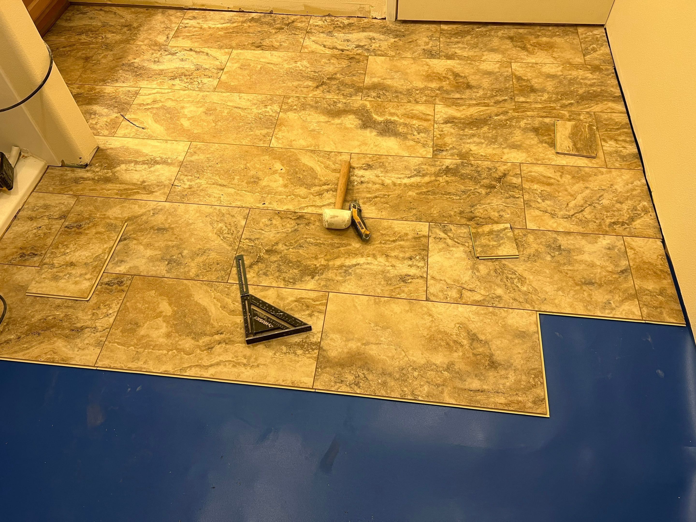 Bathroom flooring upgrade by Handyman State LLC