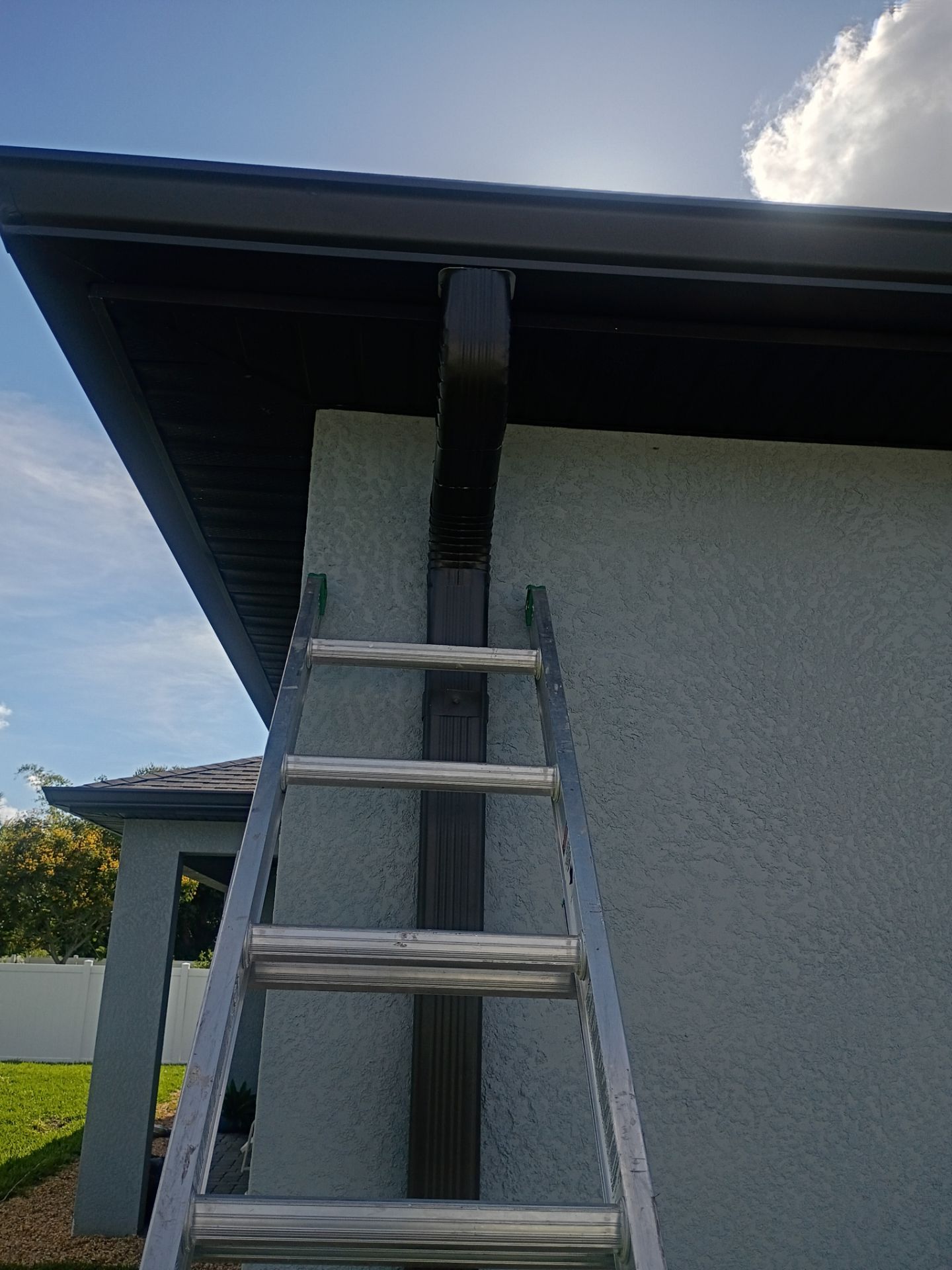 Dark Bronze Seamless Gutters using 6 Inch Seamless Gutters in Cape Coral FL by Gutter Professors