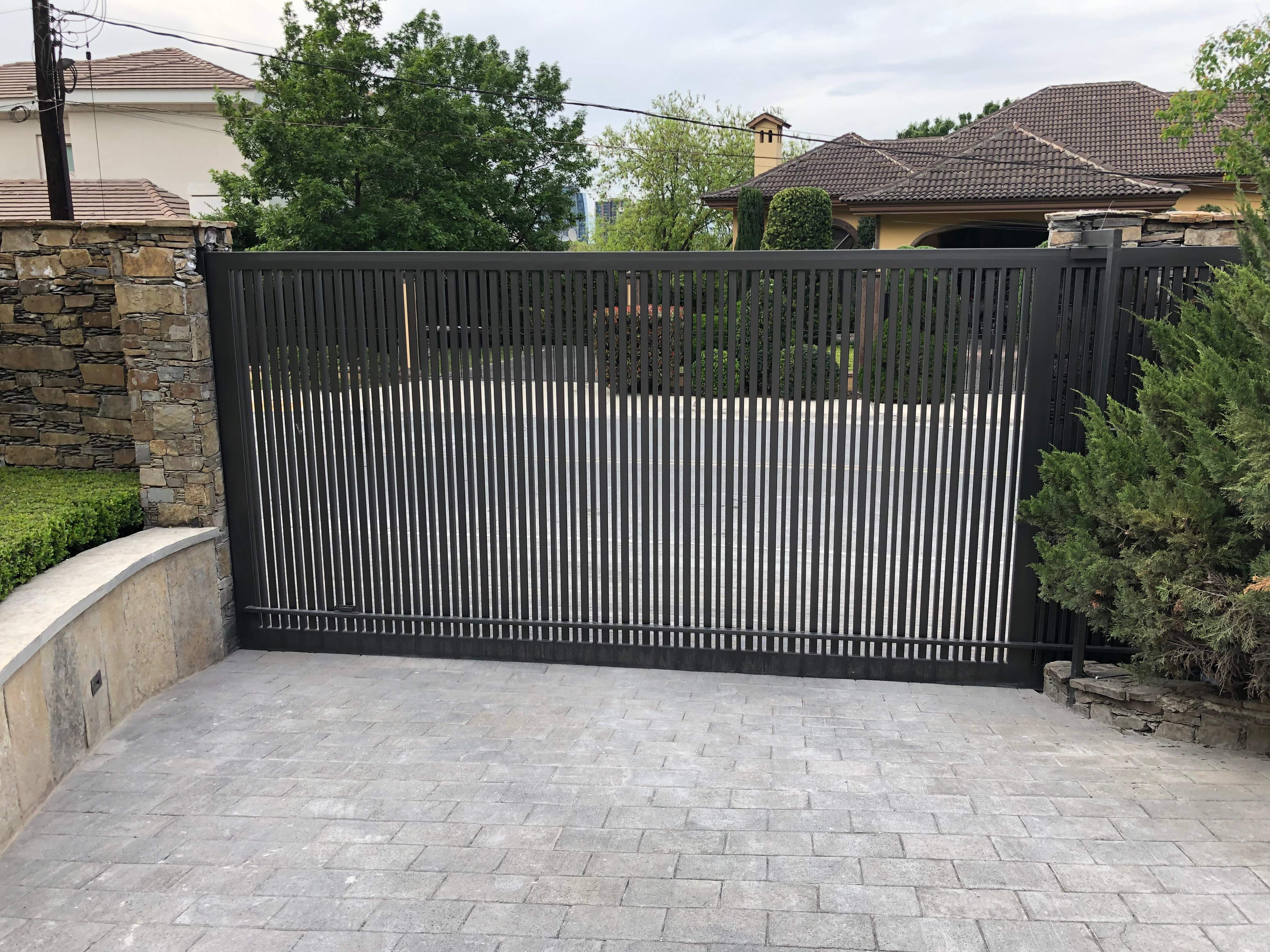 Custom Stone Entryway and Secure Perimeter Gate Installation in Monterrey by Solara Custom Living