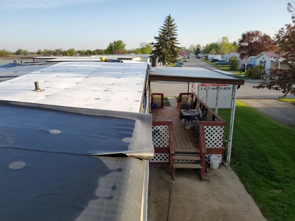 Residential Roofing Installation using 60 mil rubber roof  by Nitro Roofing and Construction