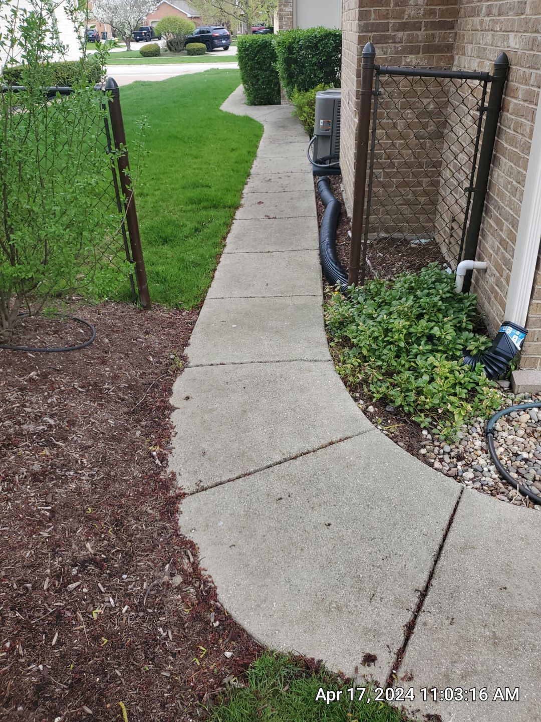 concrete patio and driveway cleaning by Northern Power Washing LLC.