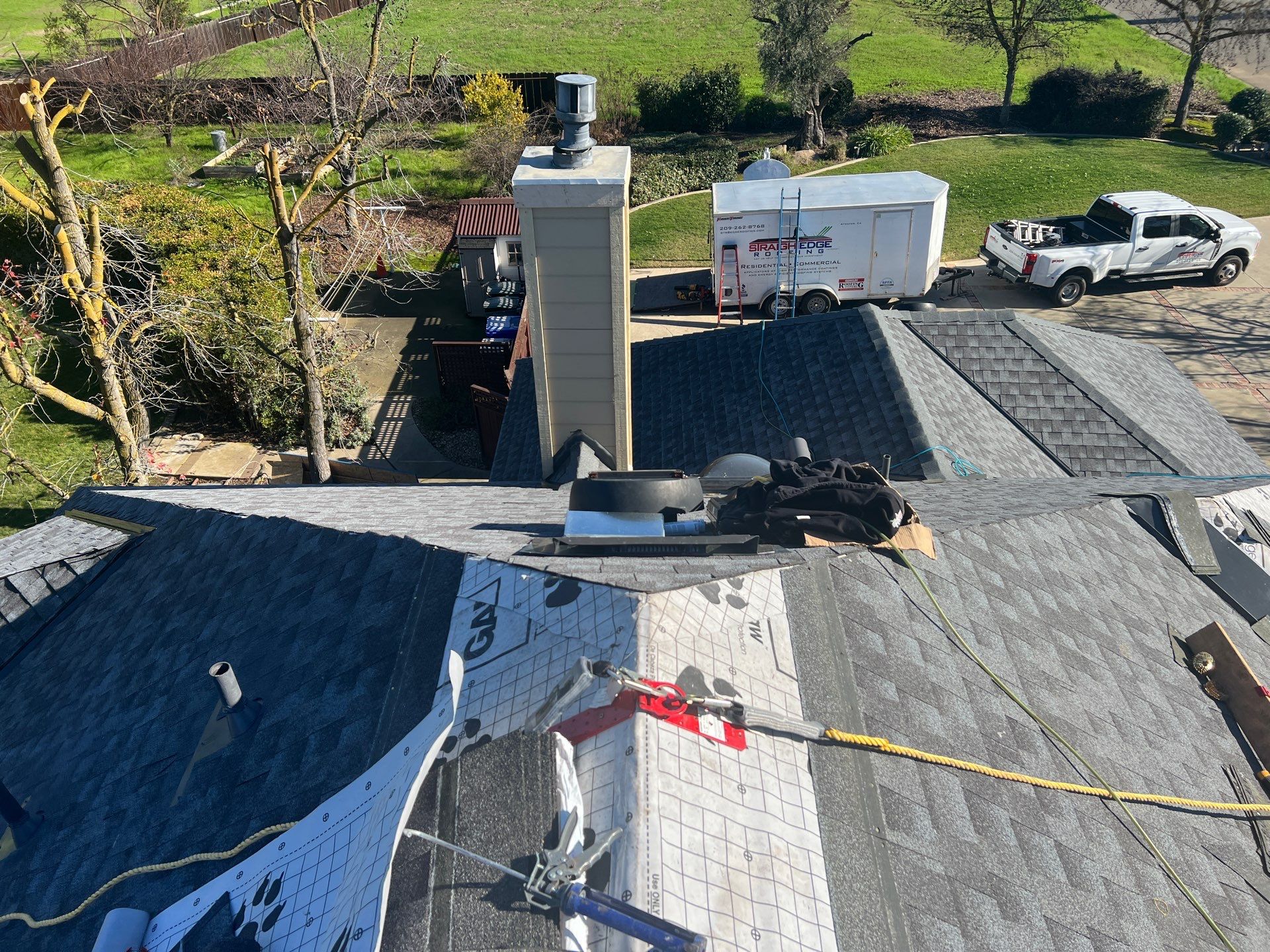 New shingles and gutters using GAF Timberline HDZ shingles and aluminum gutter by Straight Edge Roofing Inc