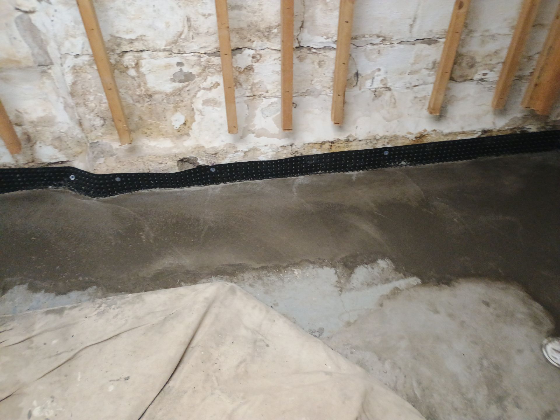 Interior Drain Tile Installation in South Minneapolis by Waterproofing Northeast