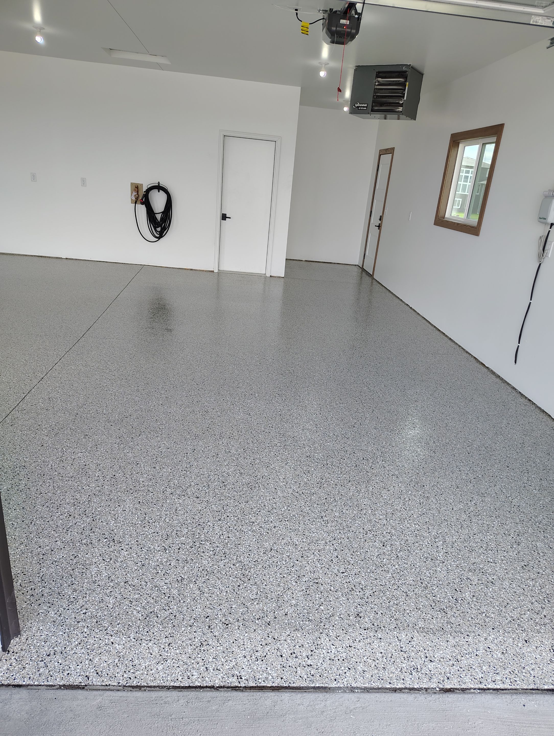 Gray and White Speckled Epoxy Garage Floor Coating in Tea by Select Painting, Coatings & Garage Cabinets