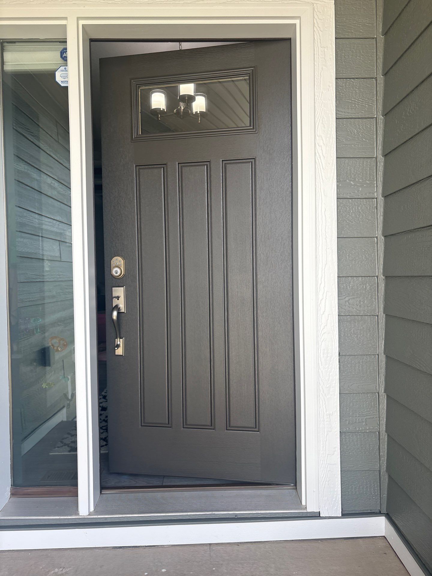 Full Exterior Home Painting on Blue Lap Siding in Sioux Falls by Select Painting, Coatings & Garage Cabinets