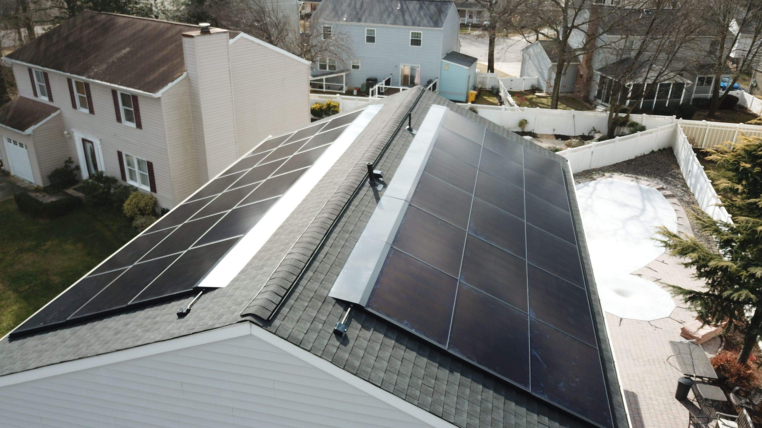 Roof Replacement with GAF Decotech integrated solar panels by American Home Contractors