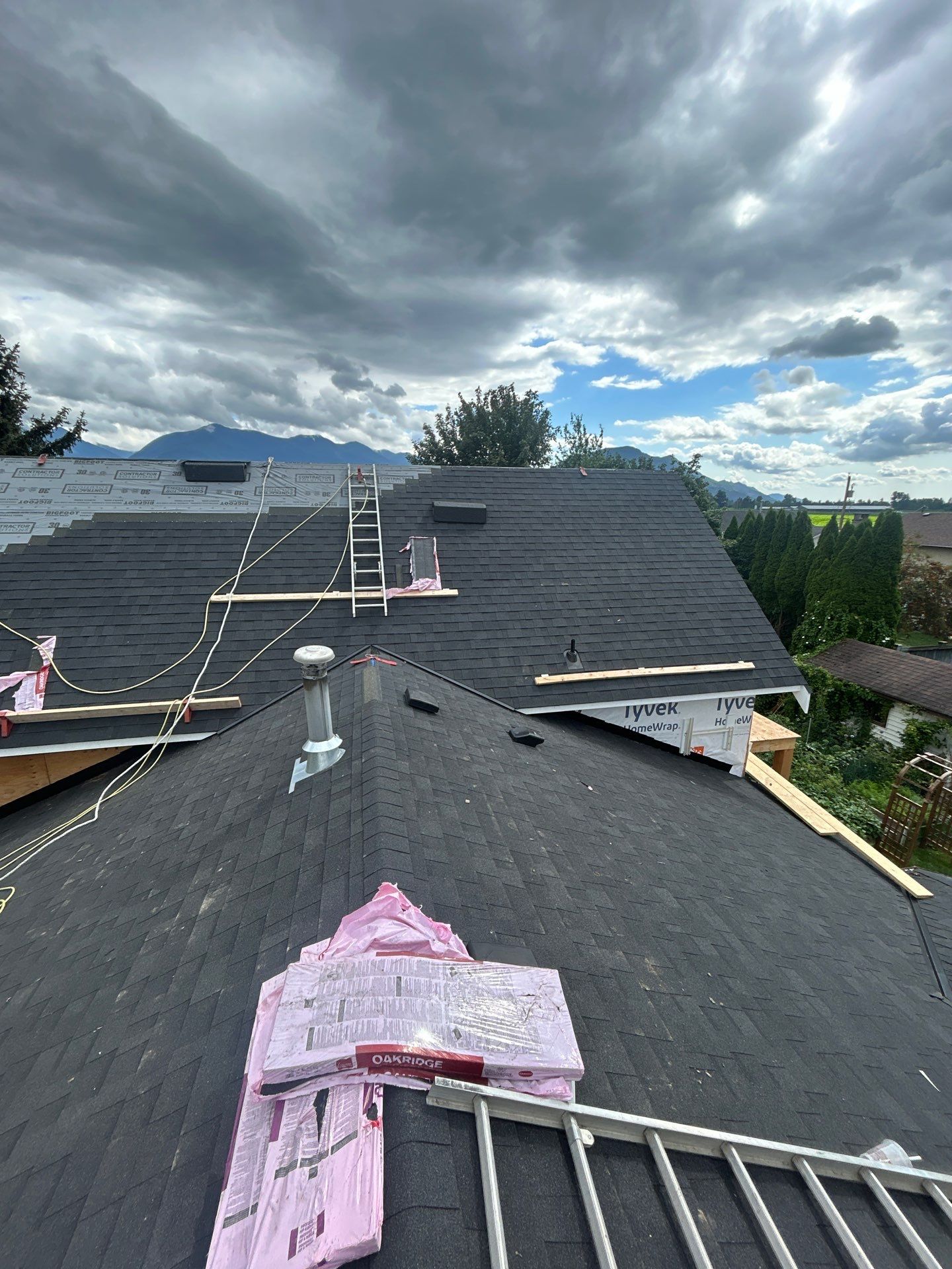Residential Roofing Installation using OC onyxs black shingle by Top Notch Roofing Inc