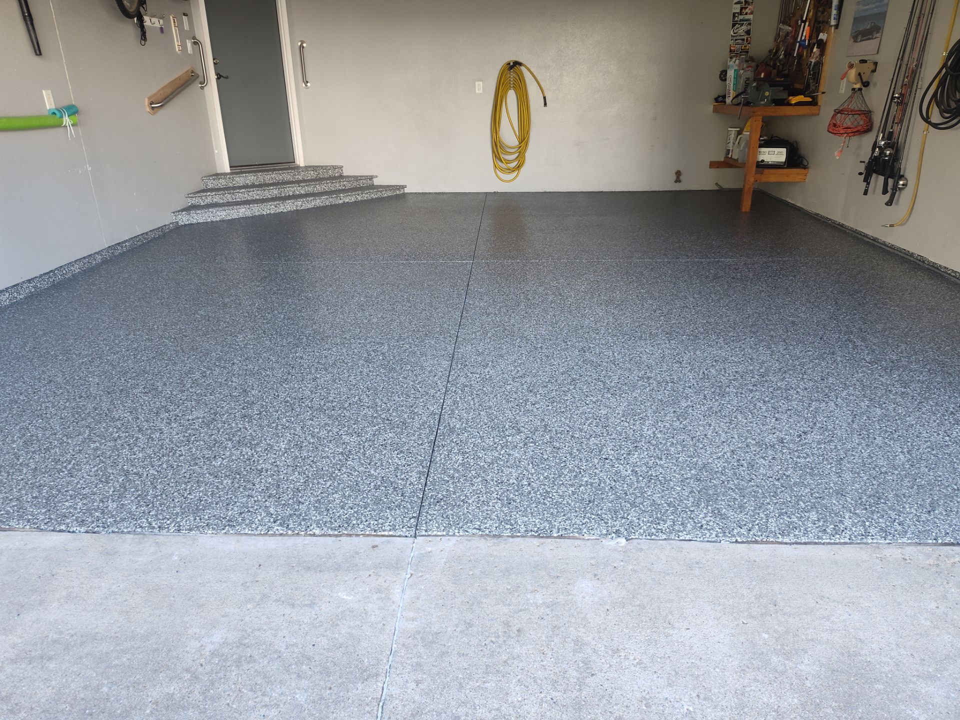 Close Up View of This Customer's New Flake Coating by Revival Concrete Coatings