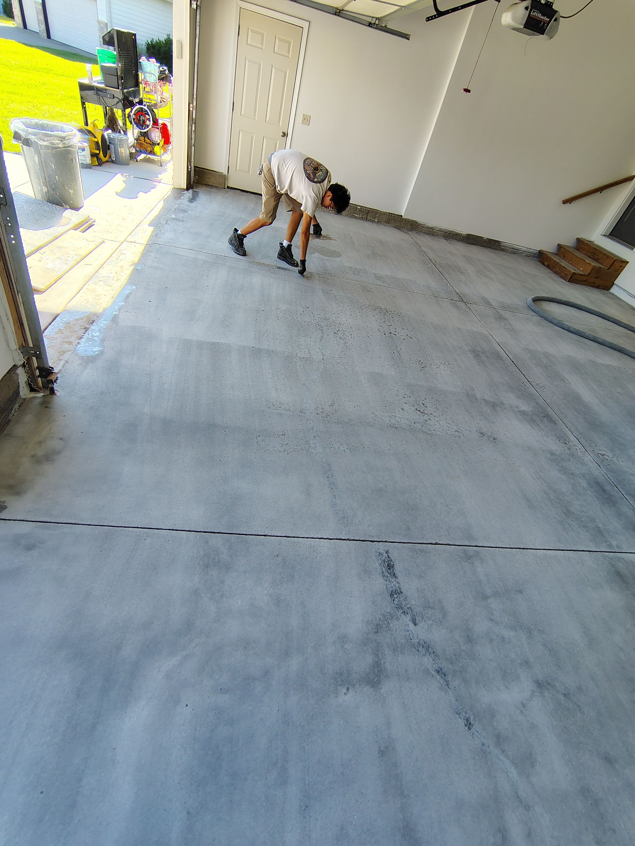 Custom Grey Speckled Epoxy Floor Coating for Sioux Falls Garage by Select Painting, Coatings & Garage Cabinets