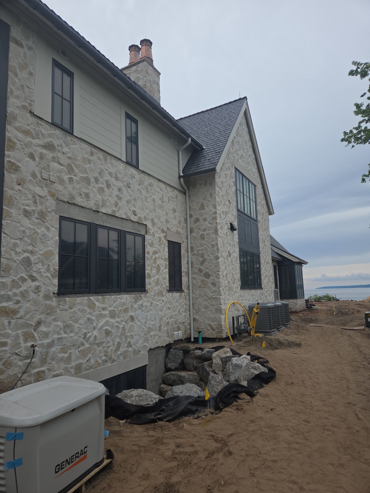 Half Round Gutter Installation for Petoskey Residence by Rainbow Seamless Systems
