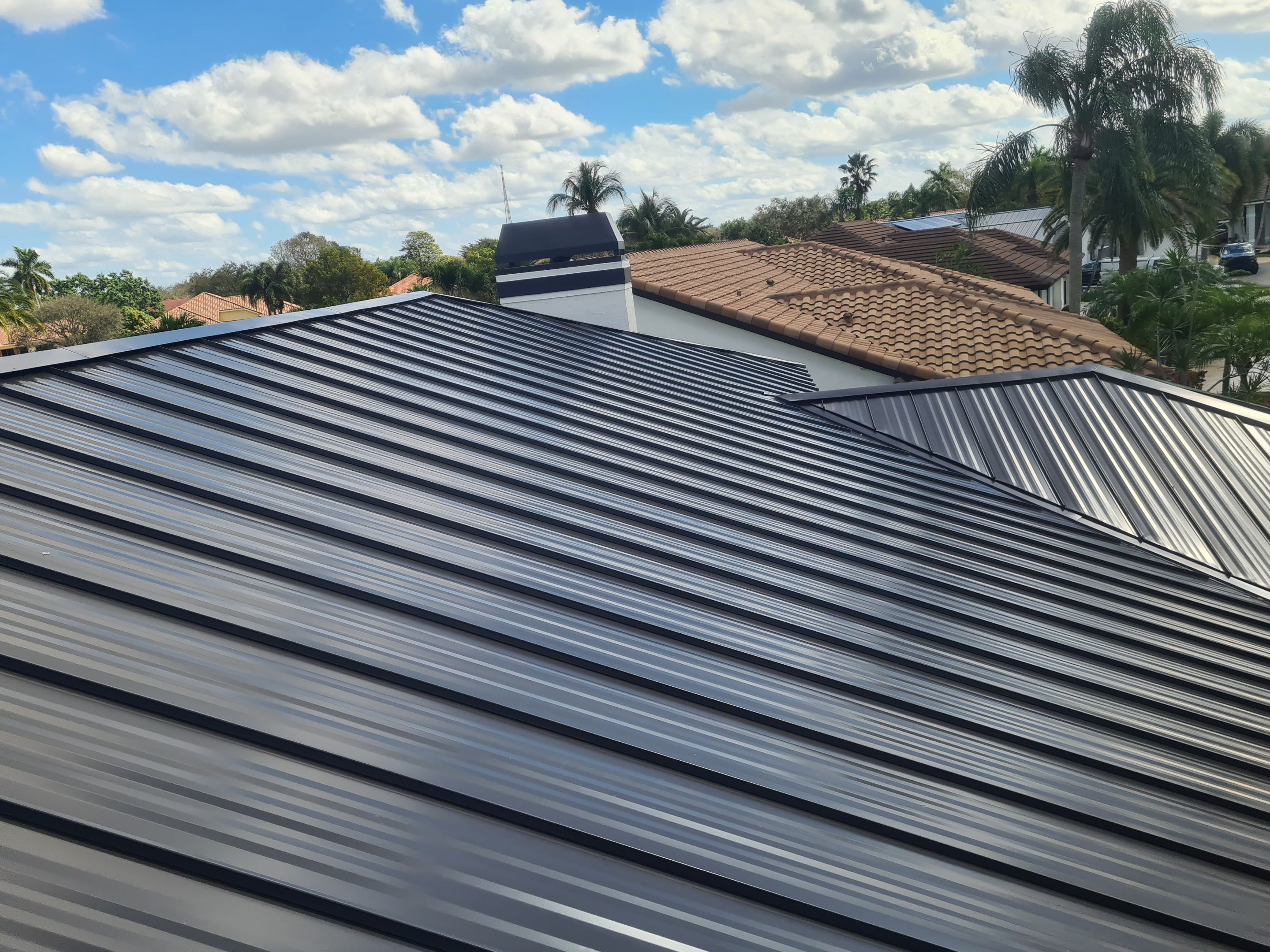 Residential Roofing Installation using 1" Nail strip metal roof by BLUES BROTHERS CONSTRUCTION CORP