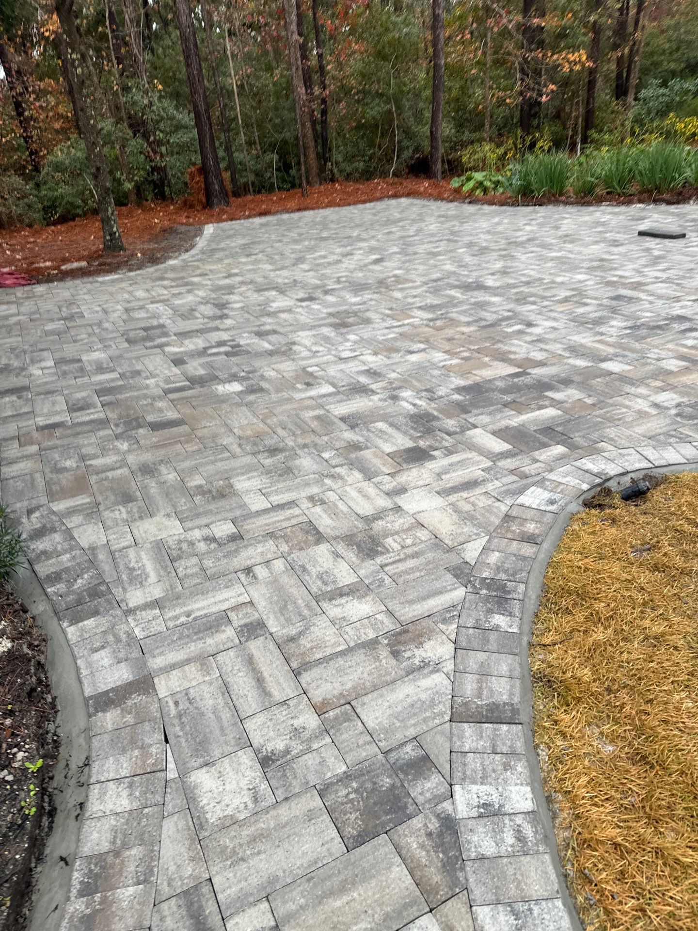 Custom Paver Driveway and Textured Pool Deck Installation in Hilton Head Island by Lowcountry Scapes, LLC