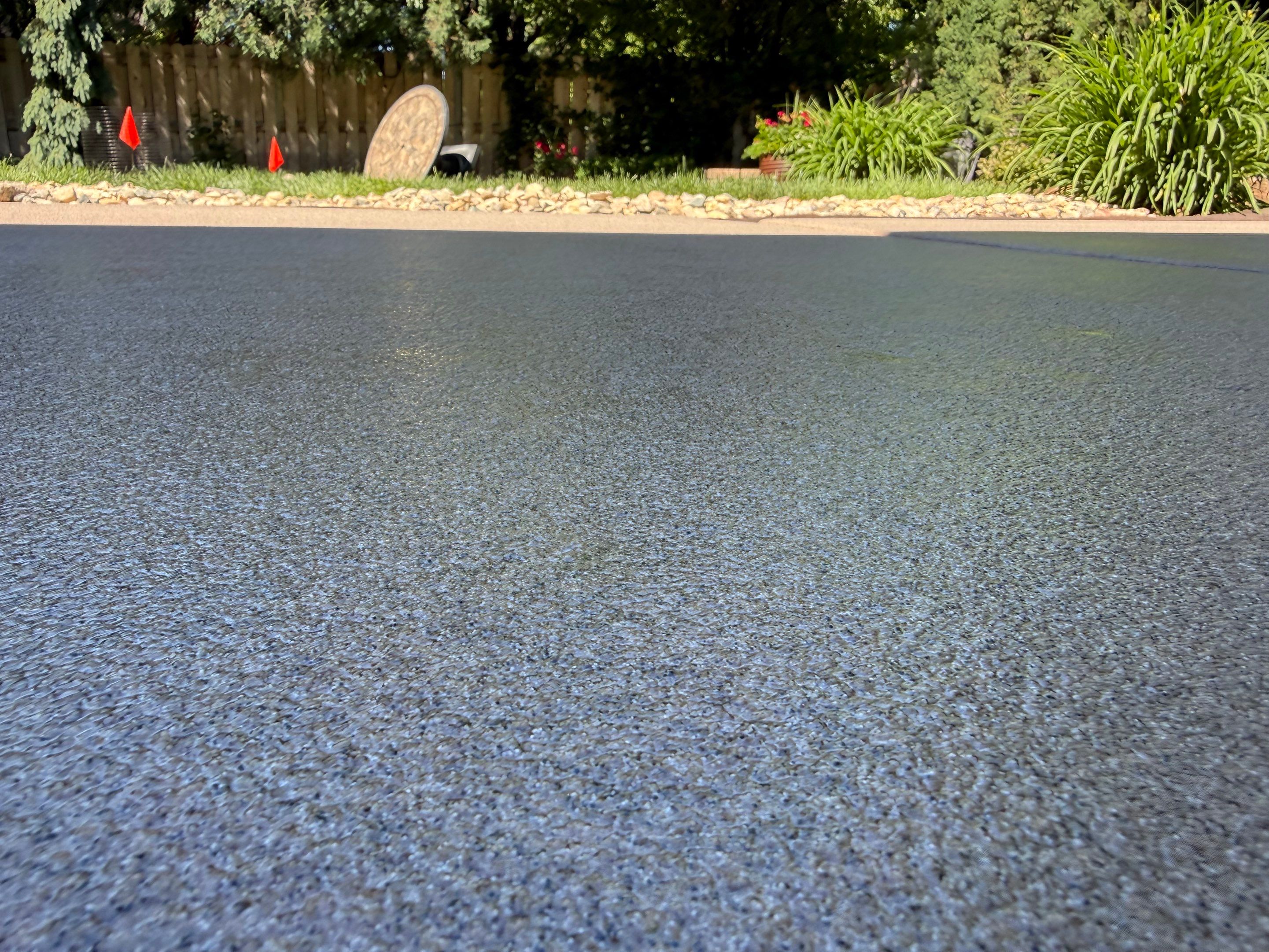 Textured Concrete Coating and Paver Patio Refresh in Sioux Falls by Select Painting, Coatings & Garage Cabinets