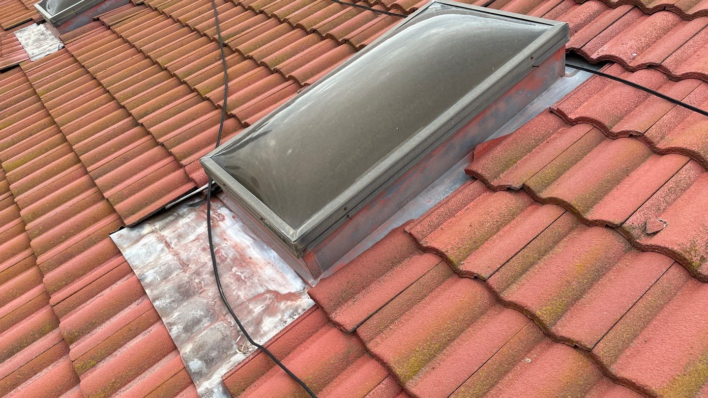 Tile refurbish project using existing tiles and replaced underlayment and battens by Straight Edge Roofing Inc