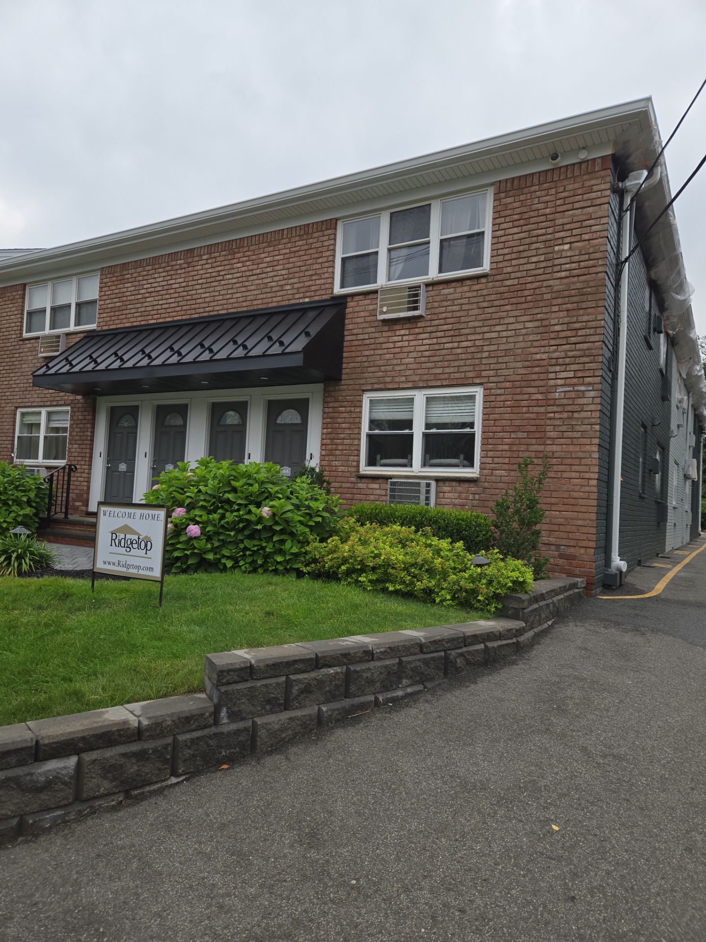 Multi-Unit Apartment Complex Exterior Brick Painting Project in Hackensack by Spectrum Painting, LLC