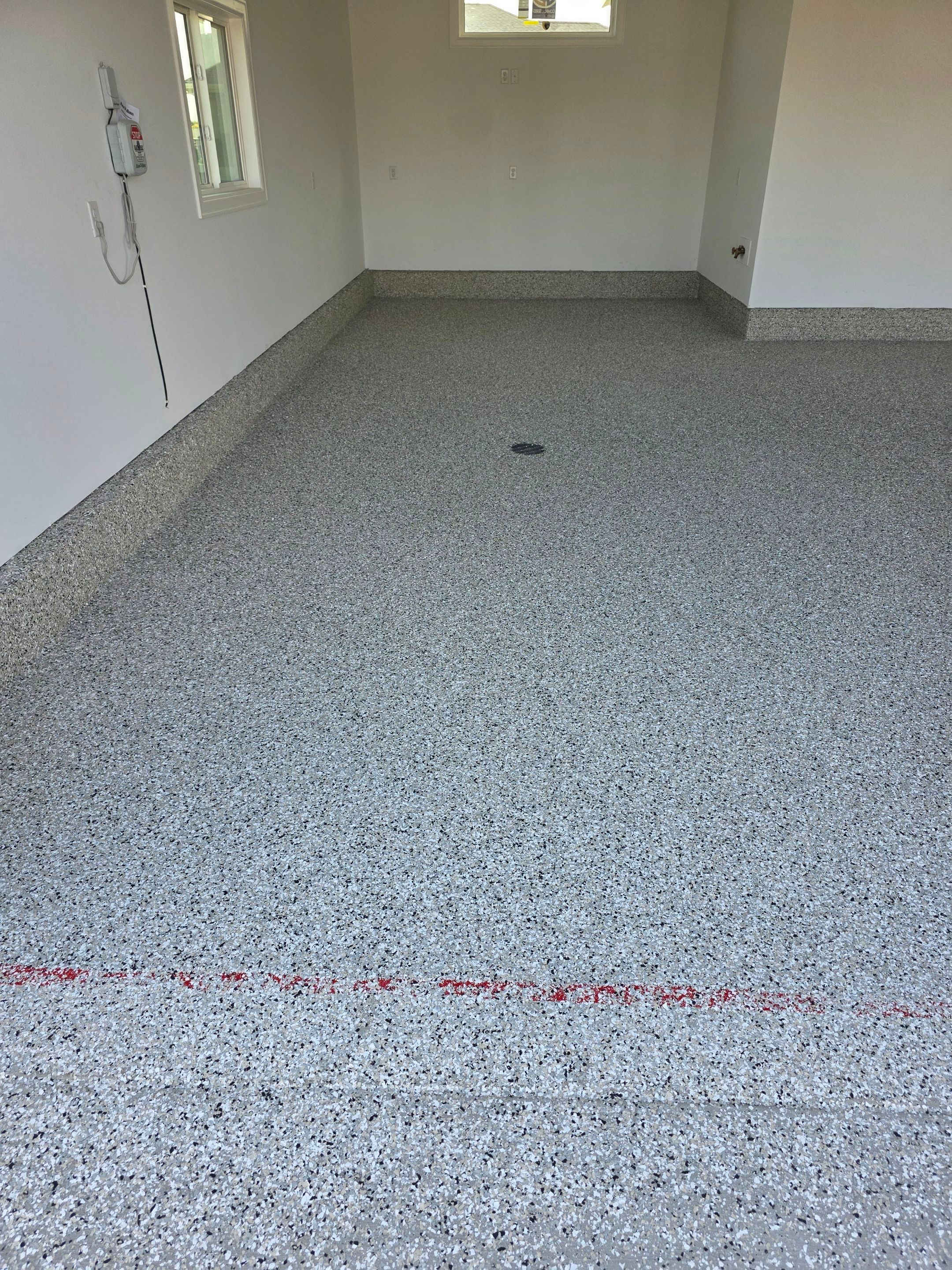 Gray and Black Speckled Polyurea Garage Floor in Dell Rapids by Select Painting, Coatings & Garage Cabinets