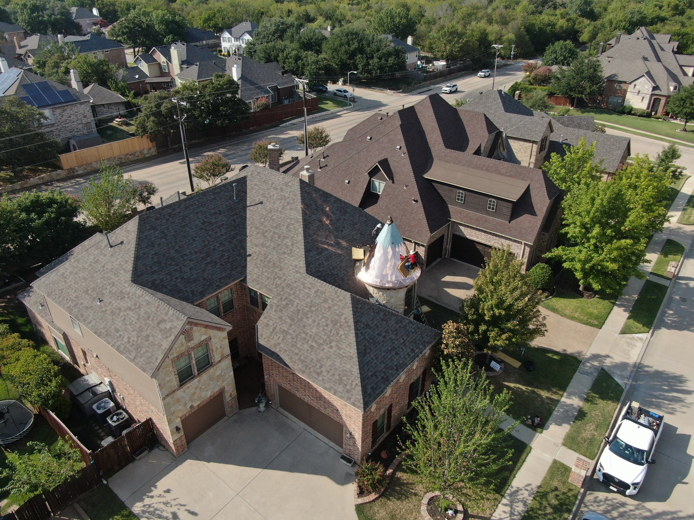 Installing Custom copper turret and Malarkey Vista Class 4 shingles Hail Damage Upgrade by Becker Roofing and Exteriors
