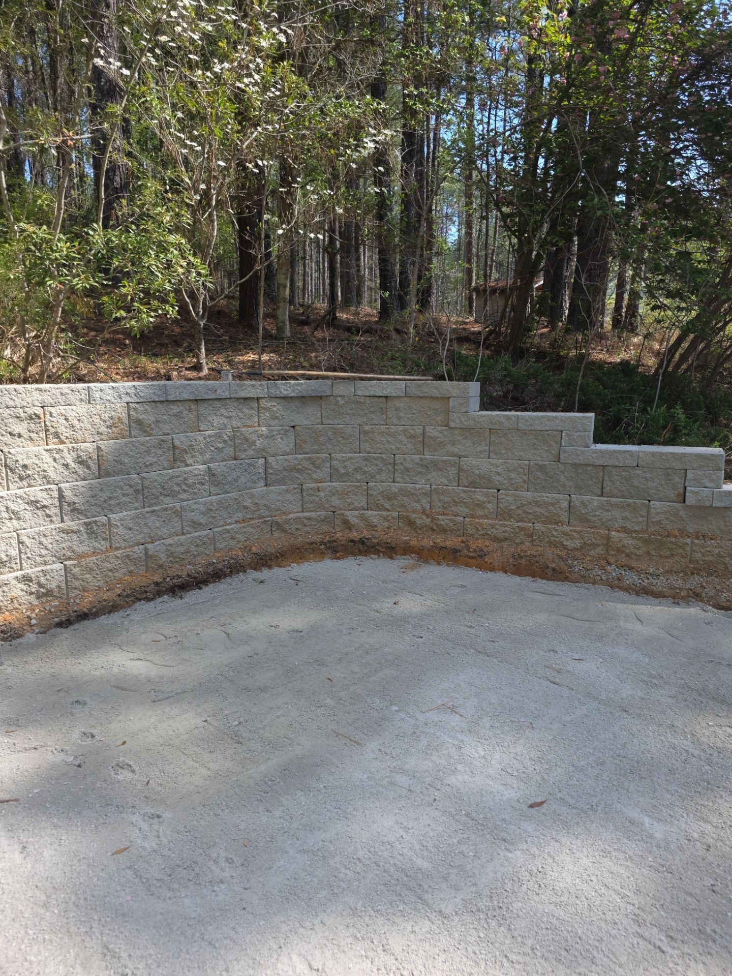 Pittsboro Outdoor Living Transformation – Retaining Wall, Paver Patio & Elevated Deck by Elite Remodeling and Design LLC