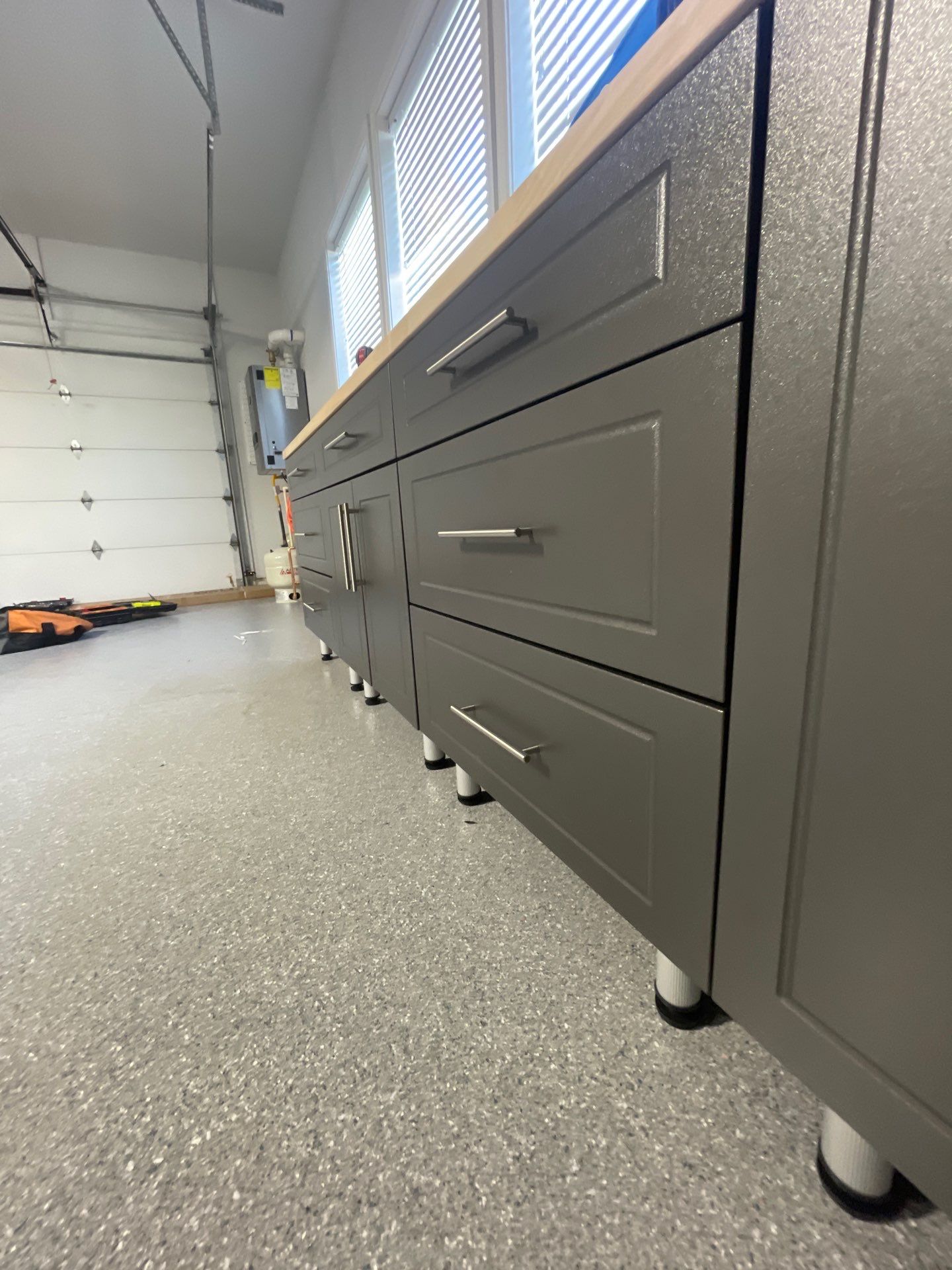 Garage Transformation using Canfield Hybrid & Grey Croc Cabinets by Croc Coatings, LLC