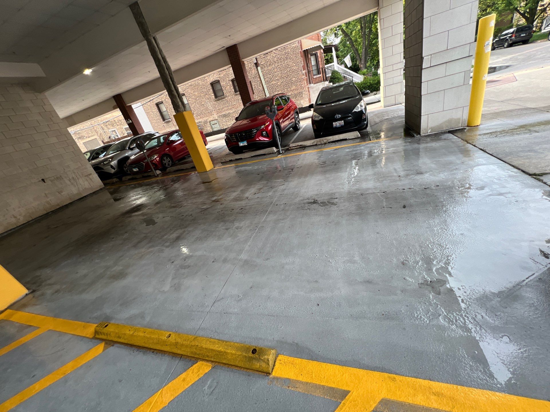 Parking garage using Hot water by Northern Power Washing LLC.