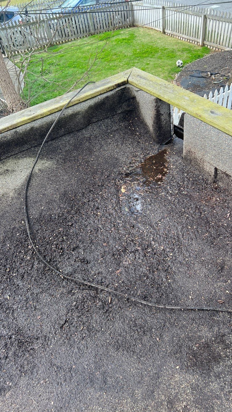 Gutter Cleaning using brown bags by Roof Bullies