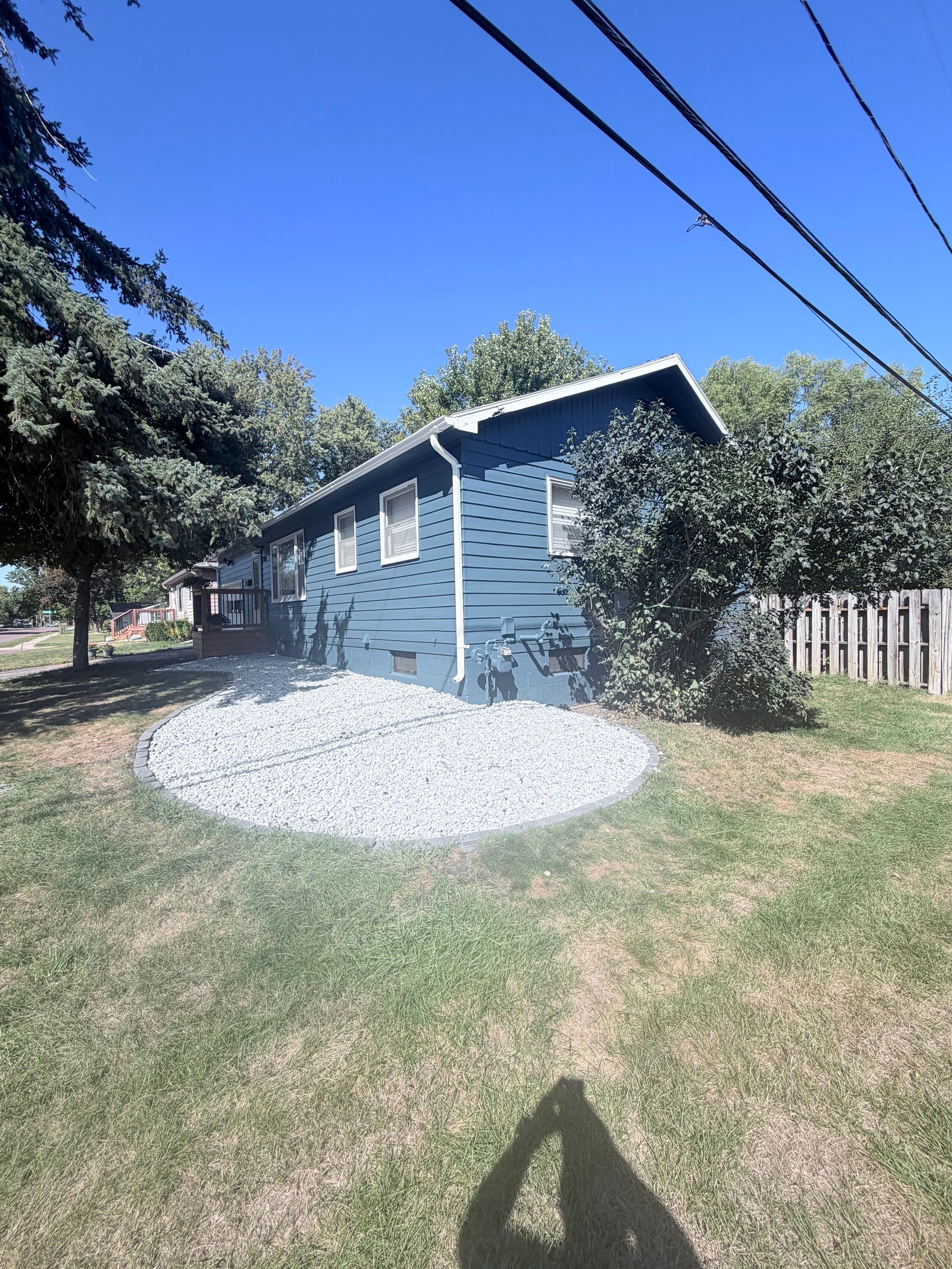 Dark Blue Exterior Painting and Trim Refresh in Sioux Falls by Select Painting, Coatings & Garage Cabinets