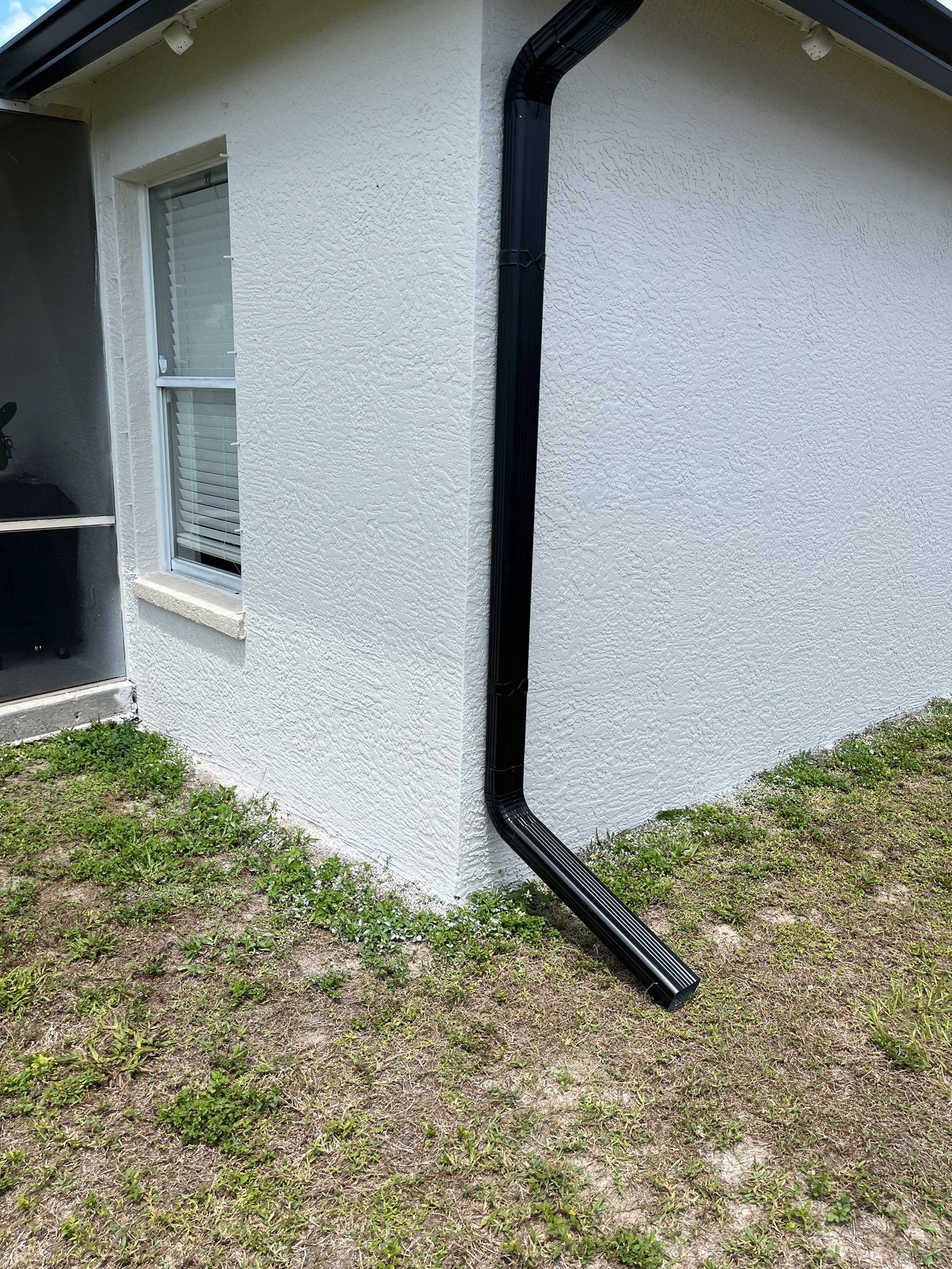 Black Seamless Gutters and Downspouts in Fort Myers FL by Gutter Professors