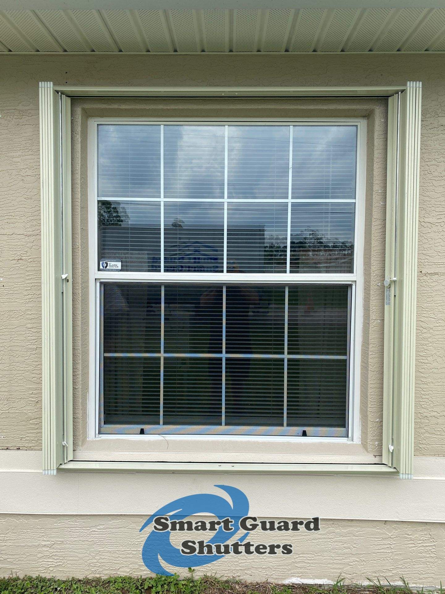 Accordion Shutters in Ivory  by Smart Guard Shutters