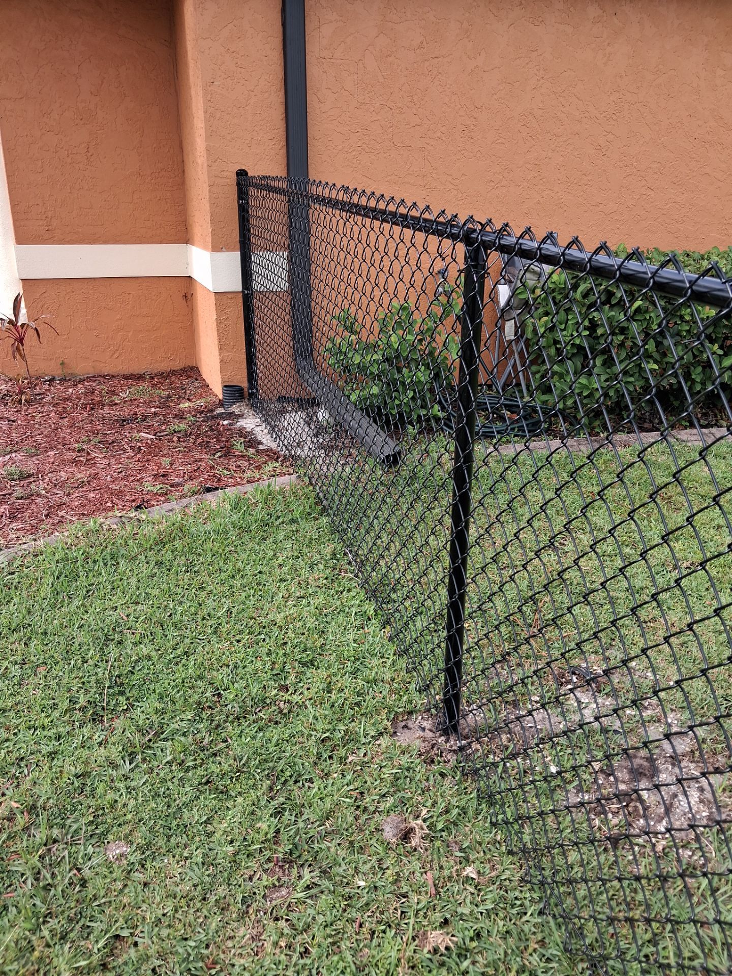 Black Chain Link Perimeter Fencing for North Port Residential Property by True Fence LLC