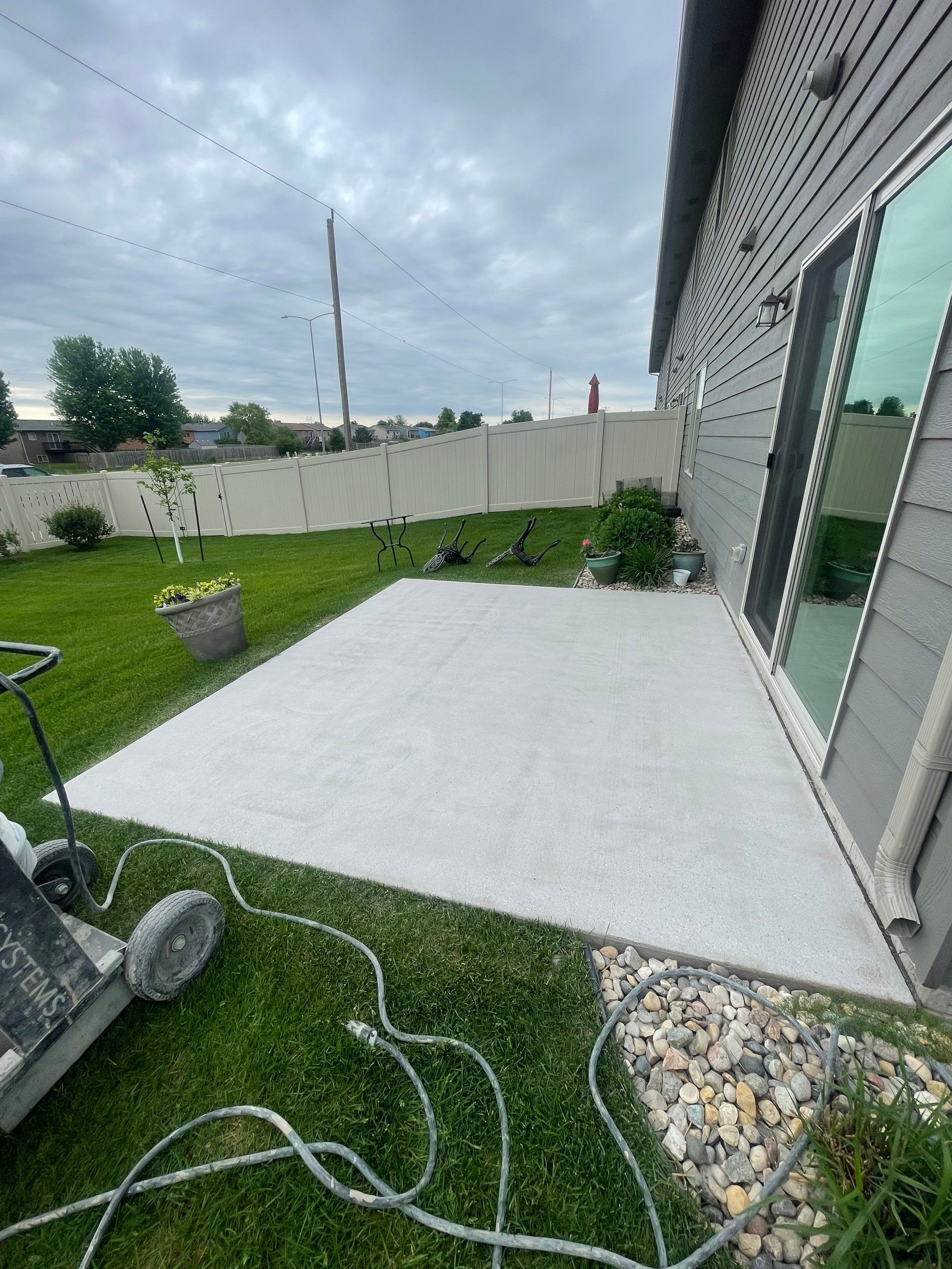Custom Concrete Coating for Sioux Falls Patio and Front Walkway by Select Painting, Coatings & Garage Cabinets