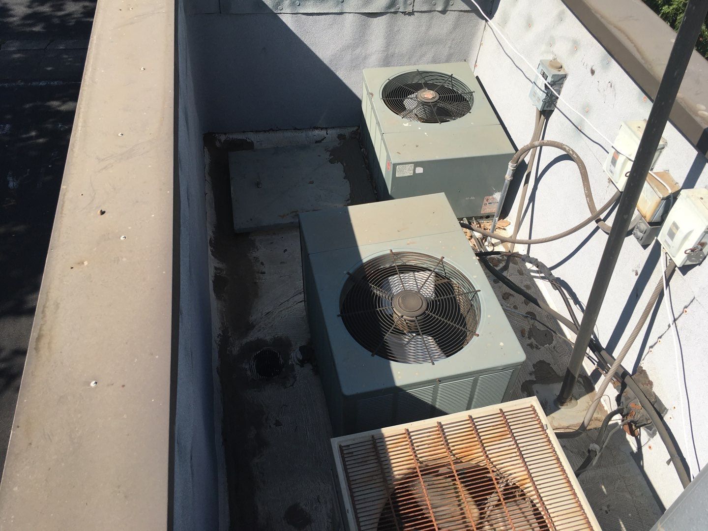 Spray foam and coatings inside commercial building HVAC well using Spray foam and coatings over existing BUR system by Straight Edge Roofing Inc