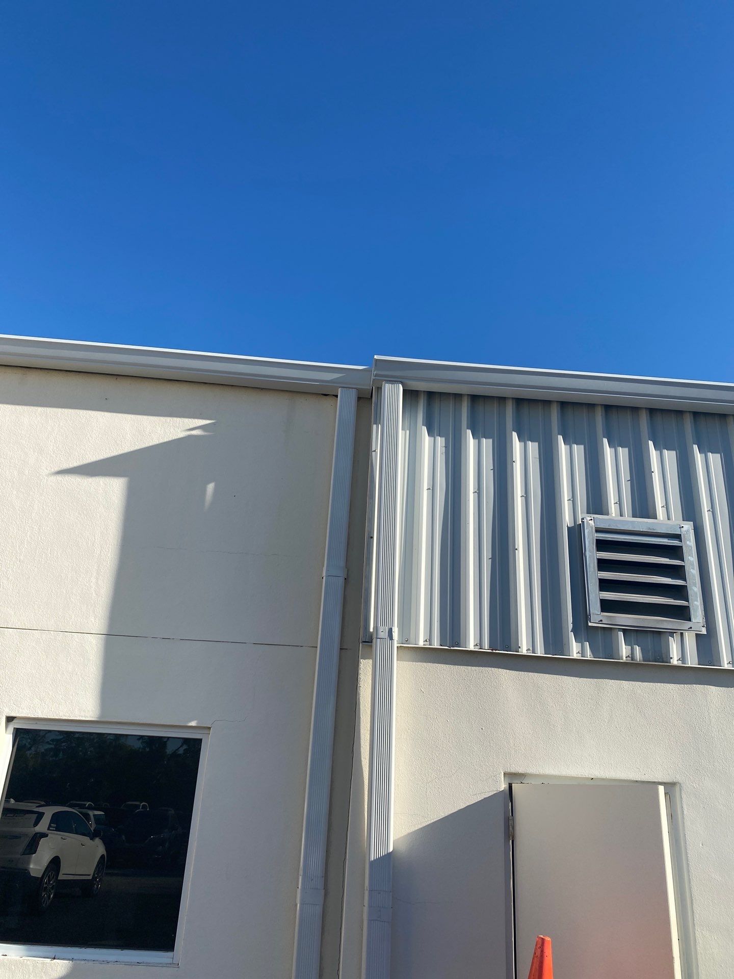 White 6-Inch Gutters with Downspouts in Bradenton FL by Gutter Professors