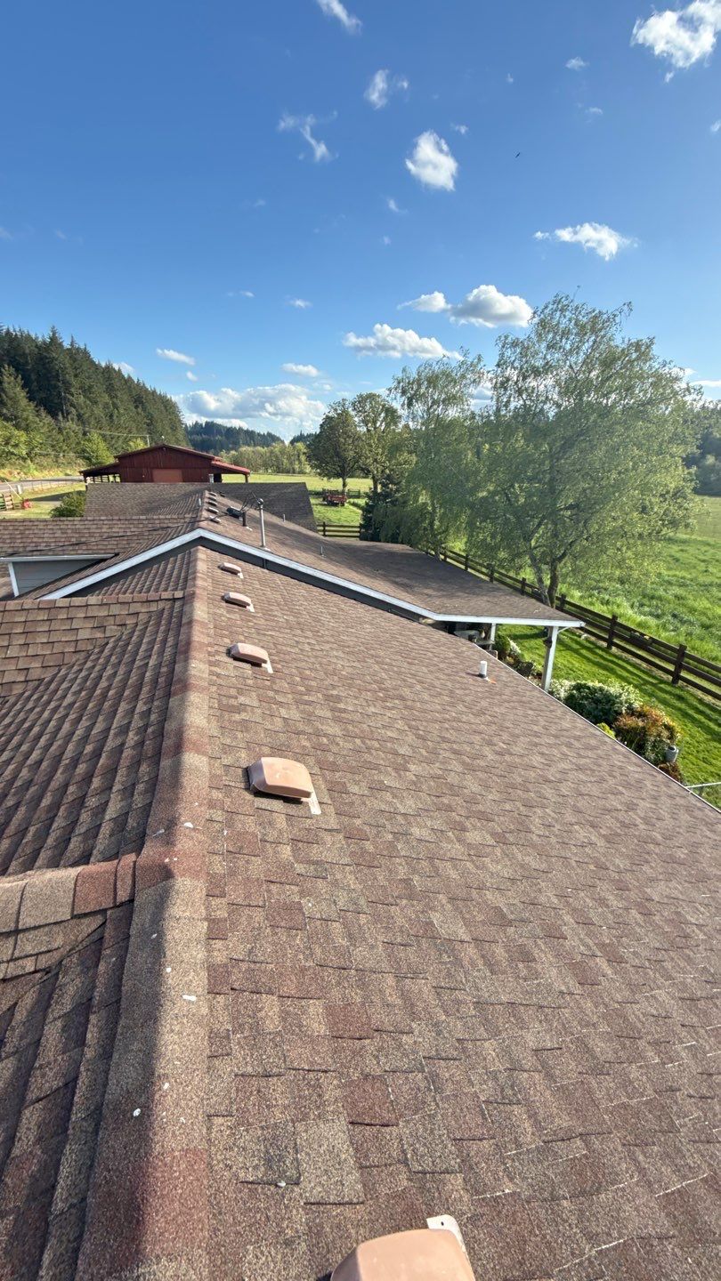 Residential Roof Replacement with Metal Accents by Orezona Building & Roofing Company, Inc.