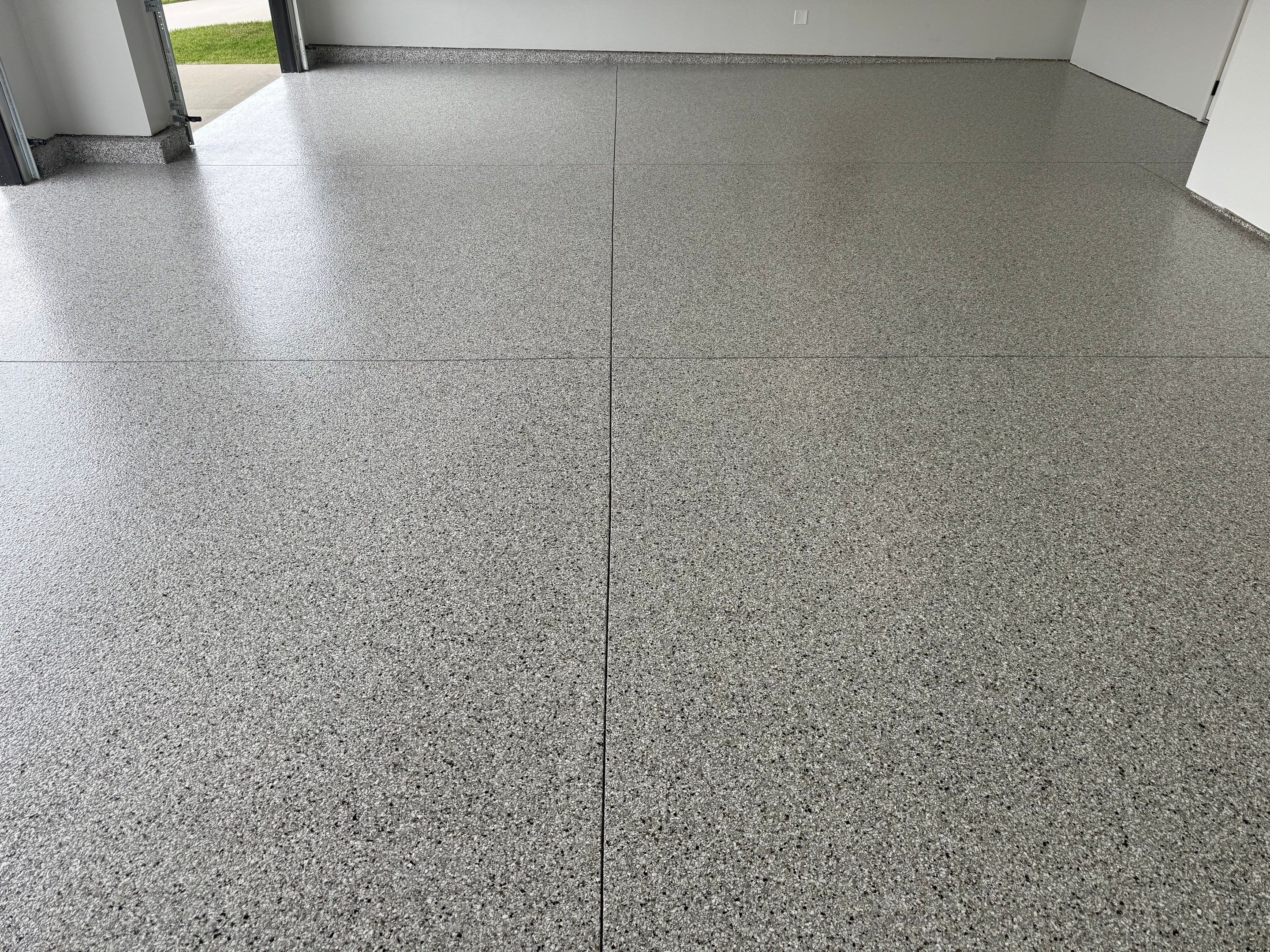 High-Gloss Epoxy Flake Garage Floor Coating in Brandon by Select Painting, Coatings & Garage Cabinets