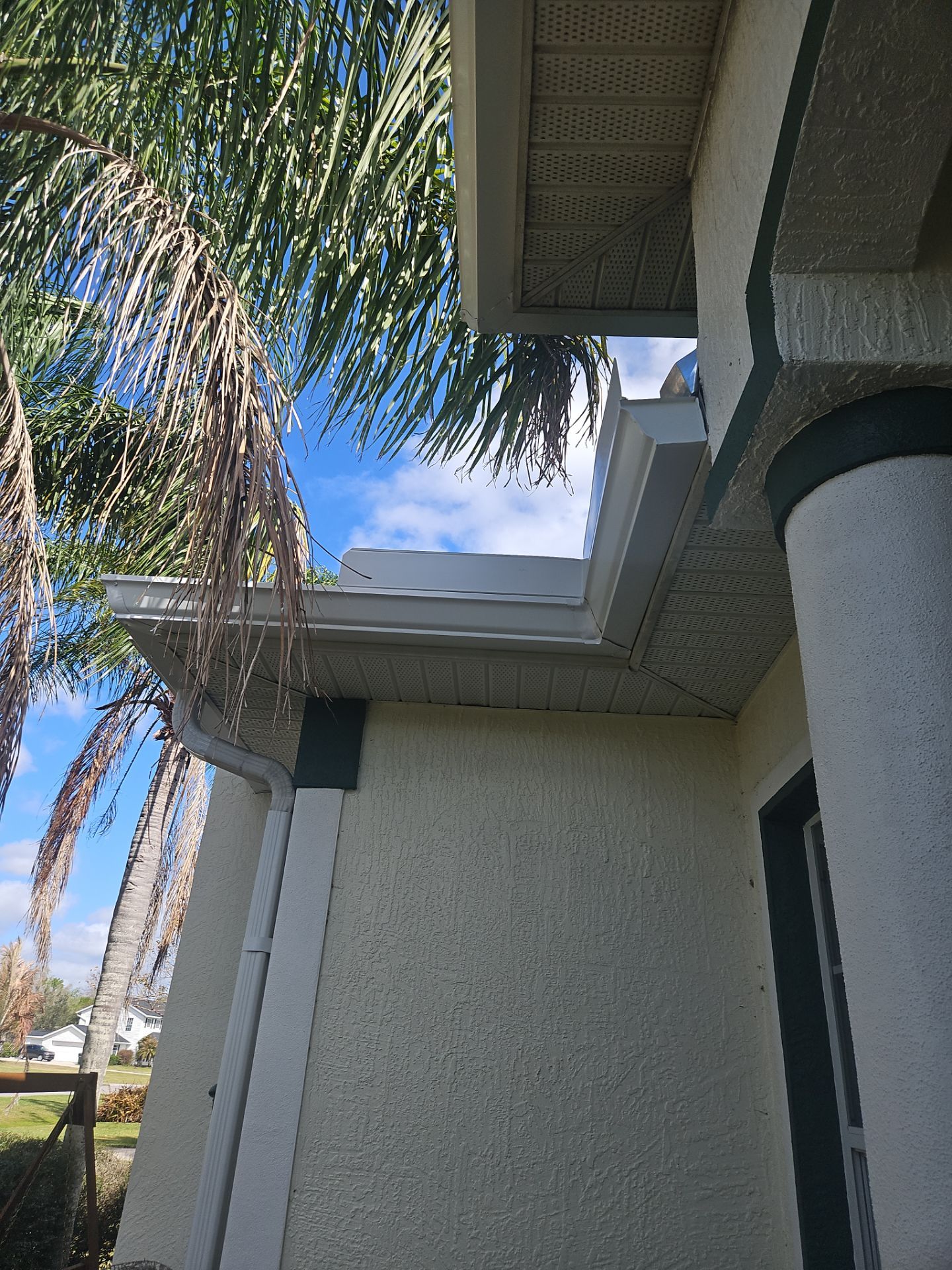White seamless Gutters and downspout repair in Sarasota FL by Gutter Professors
