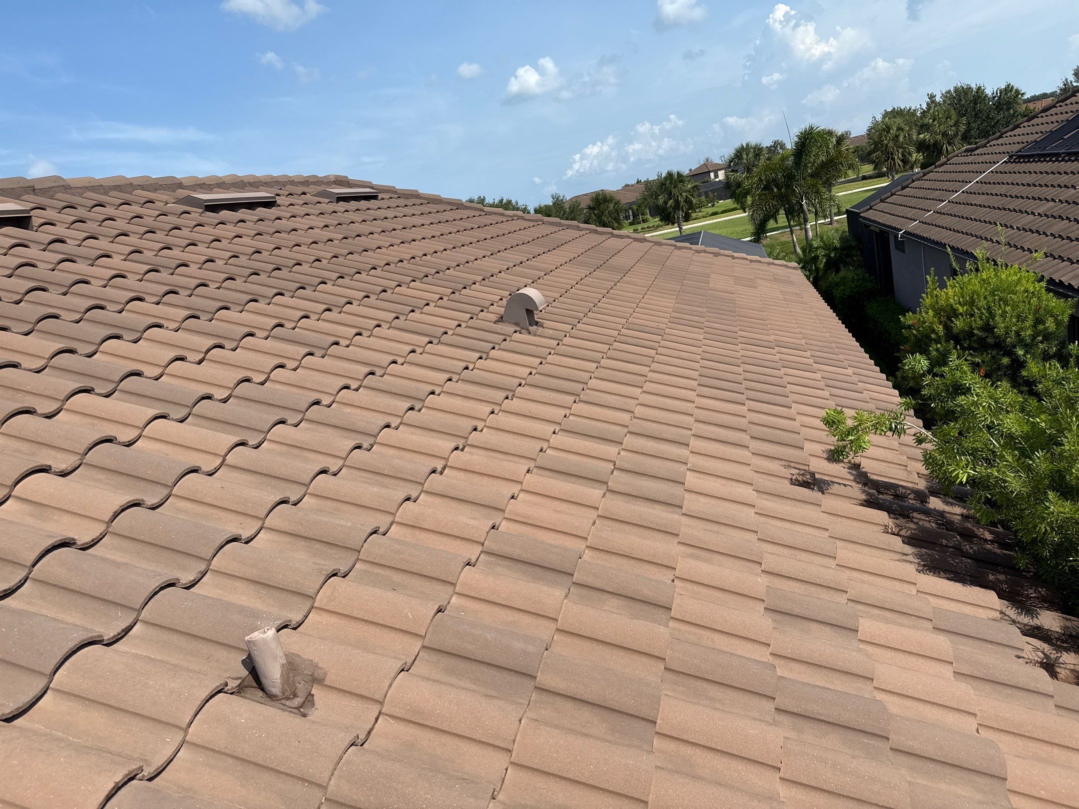Soft Wash Roof Cleaning – Concrete Tile Roof | Artisan Lakes Esplanade, Palmetto, FL by Sunshine AquaWash