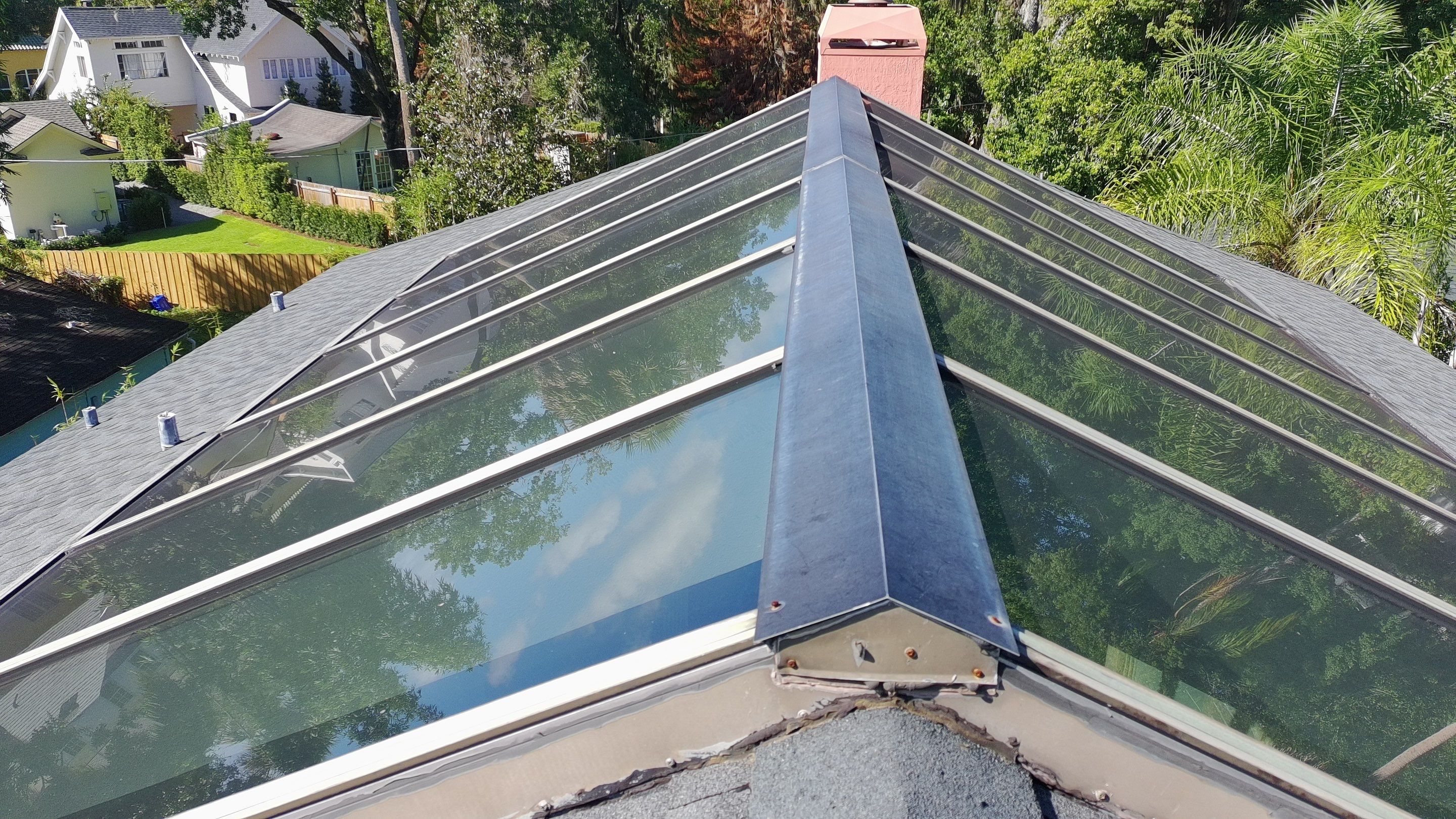 Ridge Skylight Repair and Shingle Roof Maintenance in Winter Park by Fortified Roofing Solutions Corp.