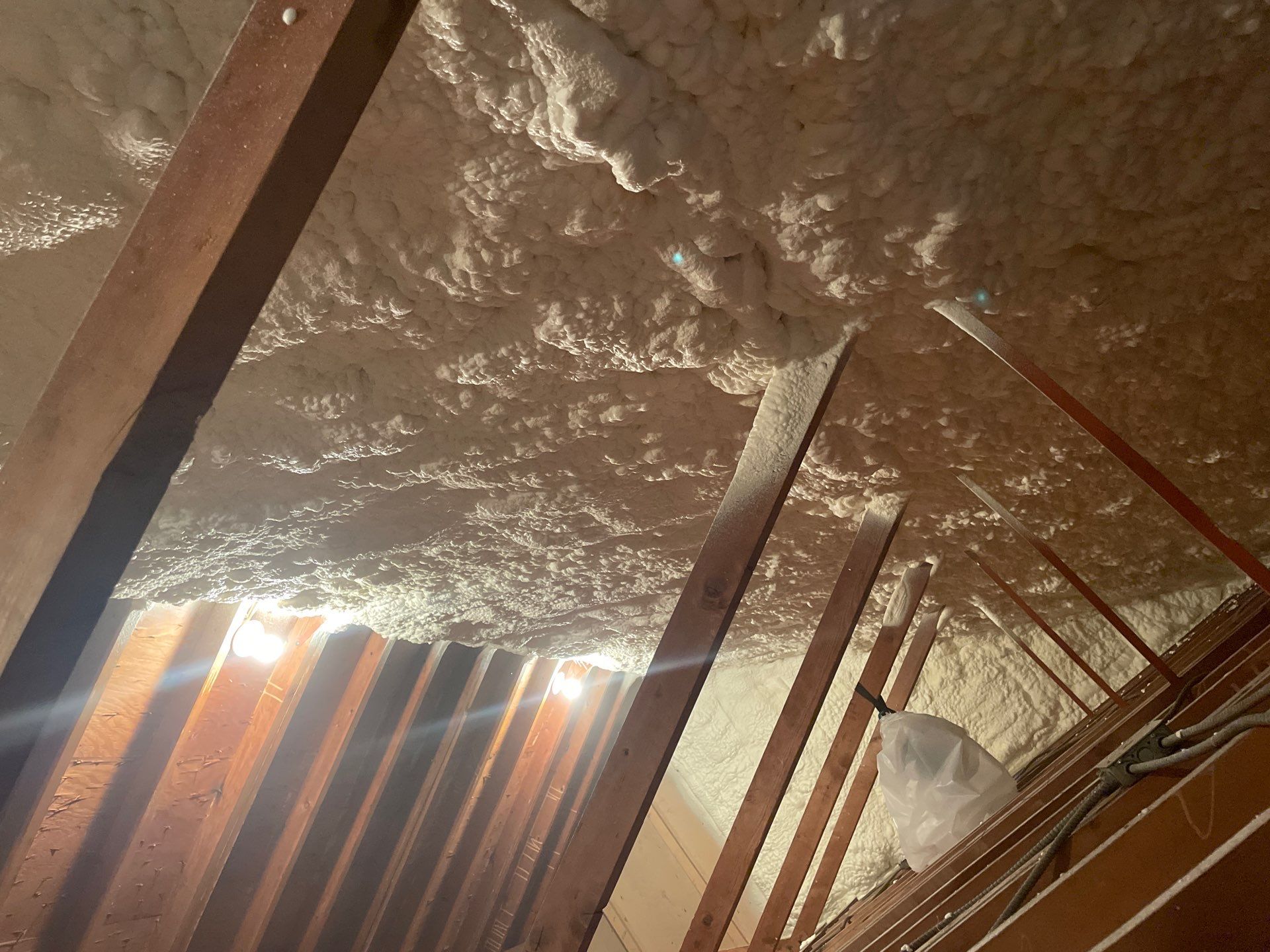 Attic Insulation using open cell spray foam by NYS Foam & Energy
