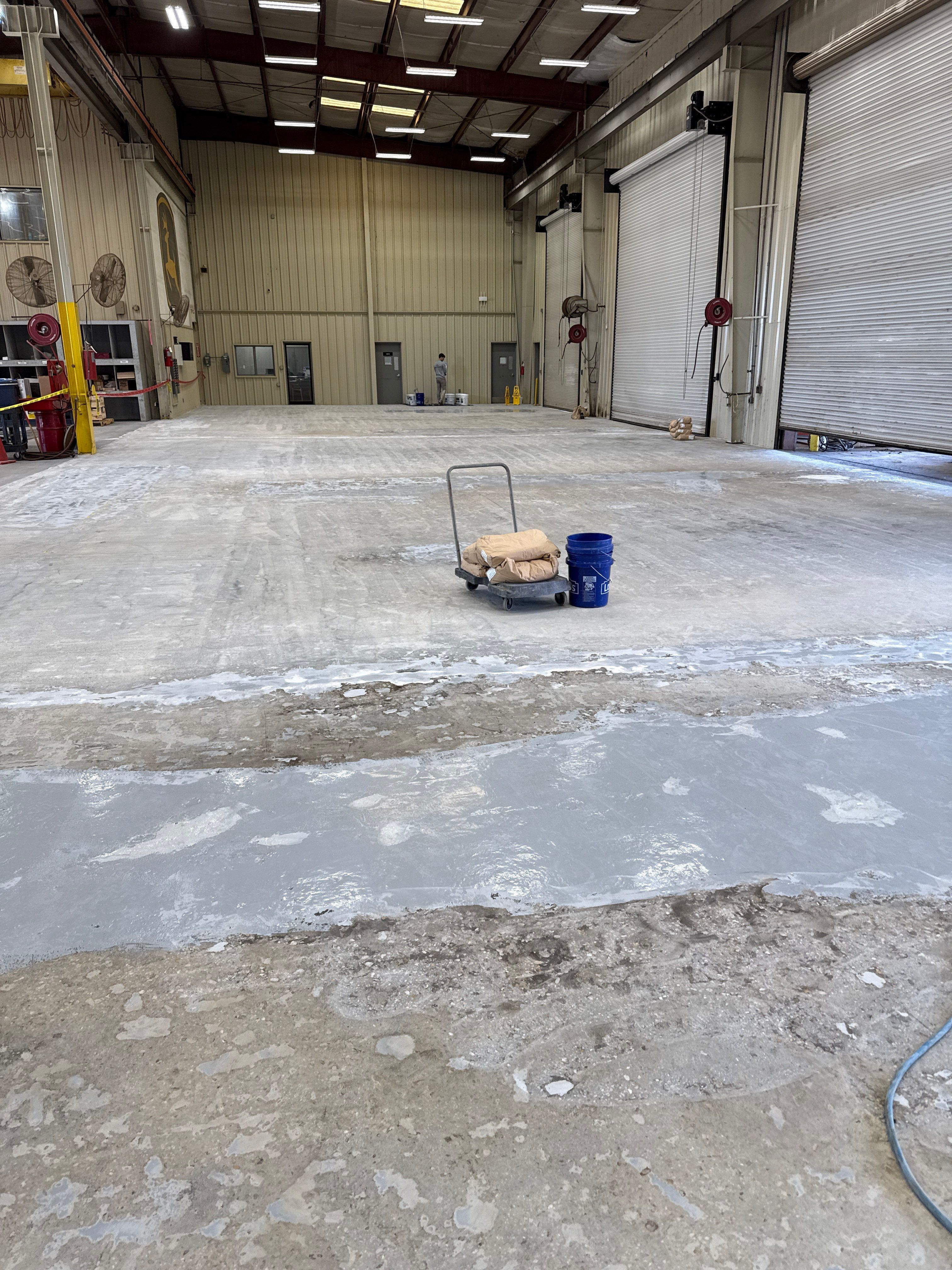 Industrial Epoxy Flooring for Heavy Equipment Work Bay in Mobile by Cornerstone Hard Surface Restoration
