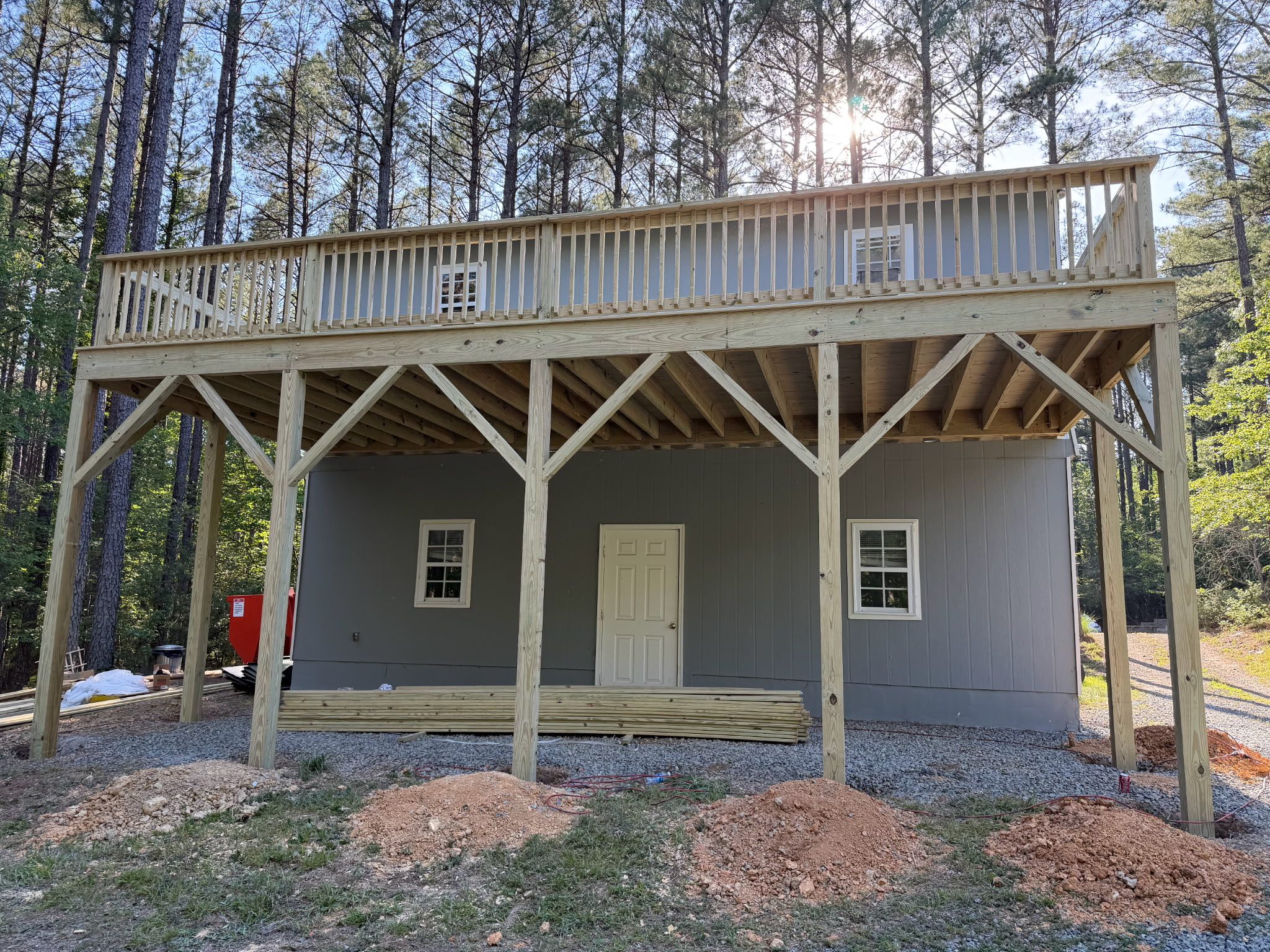 Pittsboro Outdoor Living Transformation – Retaining Wall, Paver Patio & Elevated Deck by Elite Remodeling and Design LLC