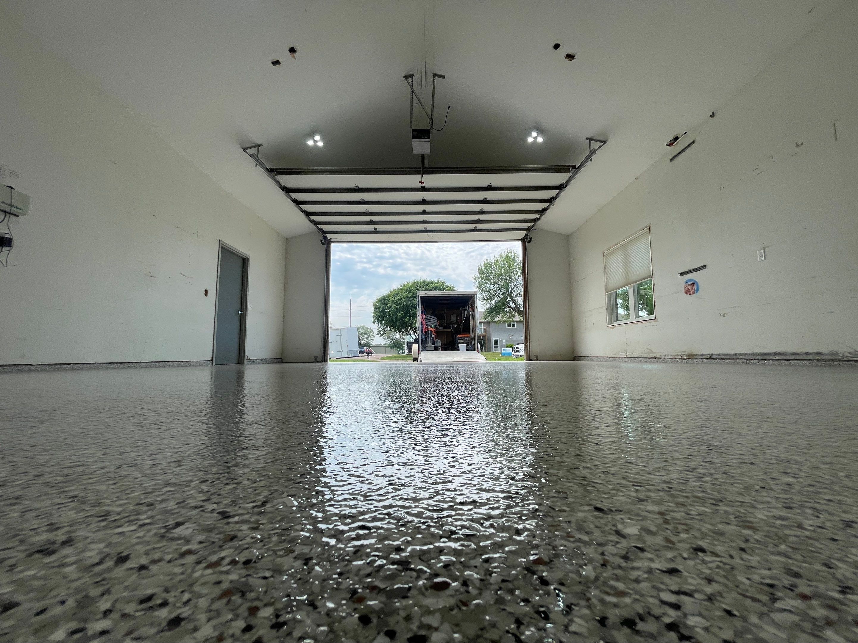 Coyote Flake Concrete Coating for Sioux Falls Garage by Select Painting, Coatings & Garage Cabinets