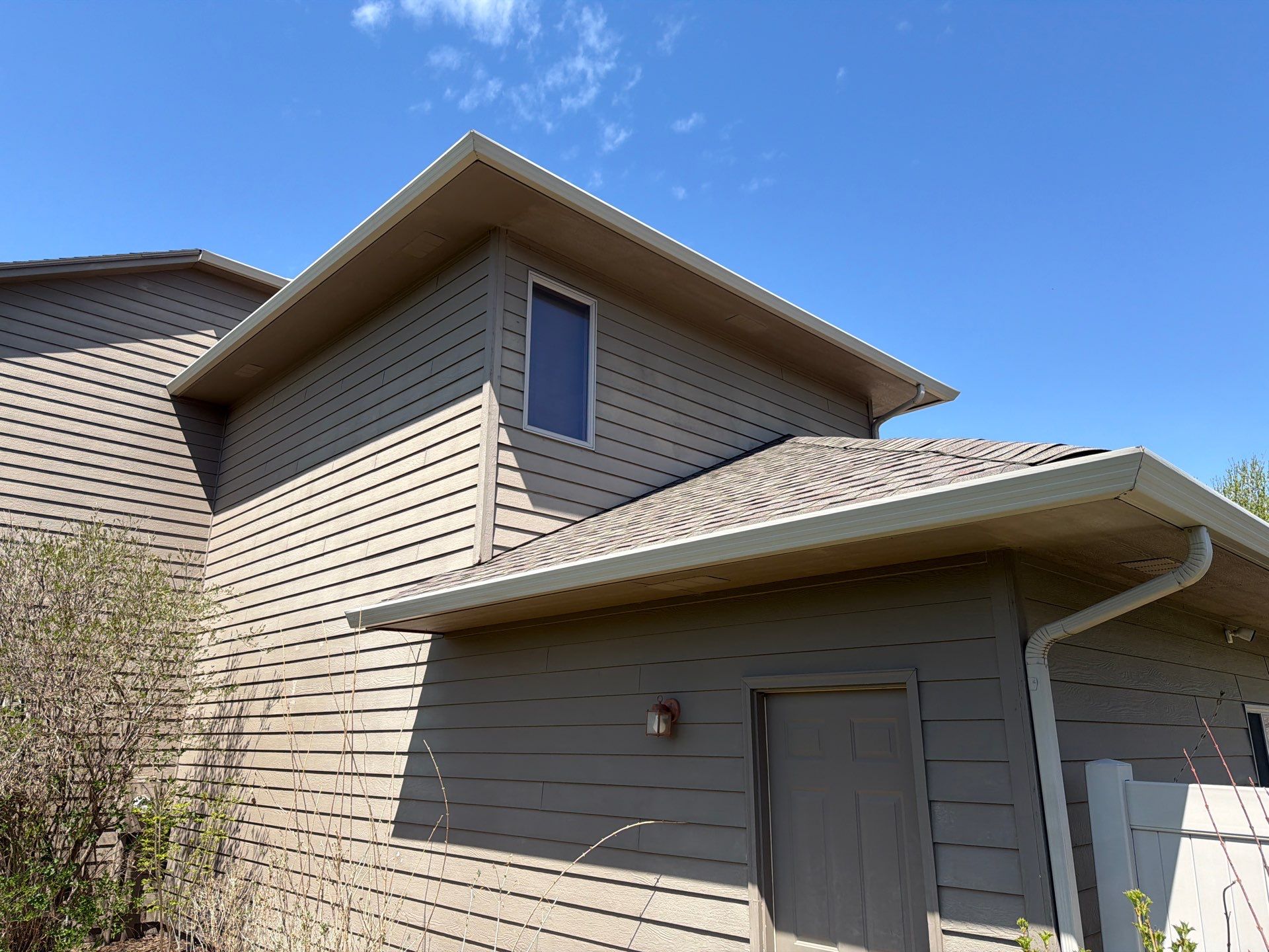 Residential Exterior Painting with Shutter and Trim Updates in Sioux Falls by Select Painting, Coatings & Garage Cabinets