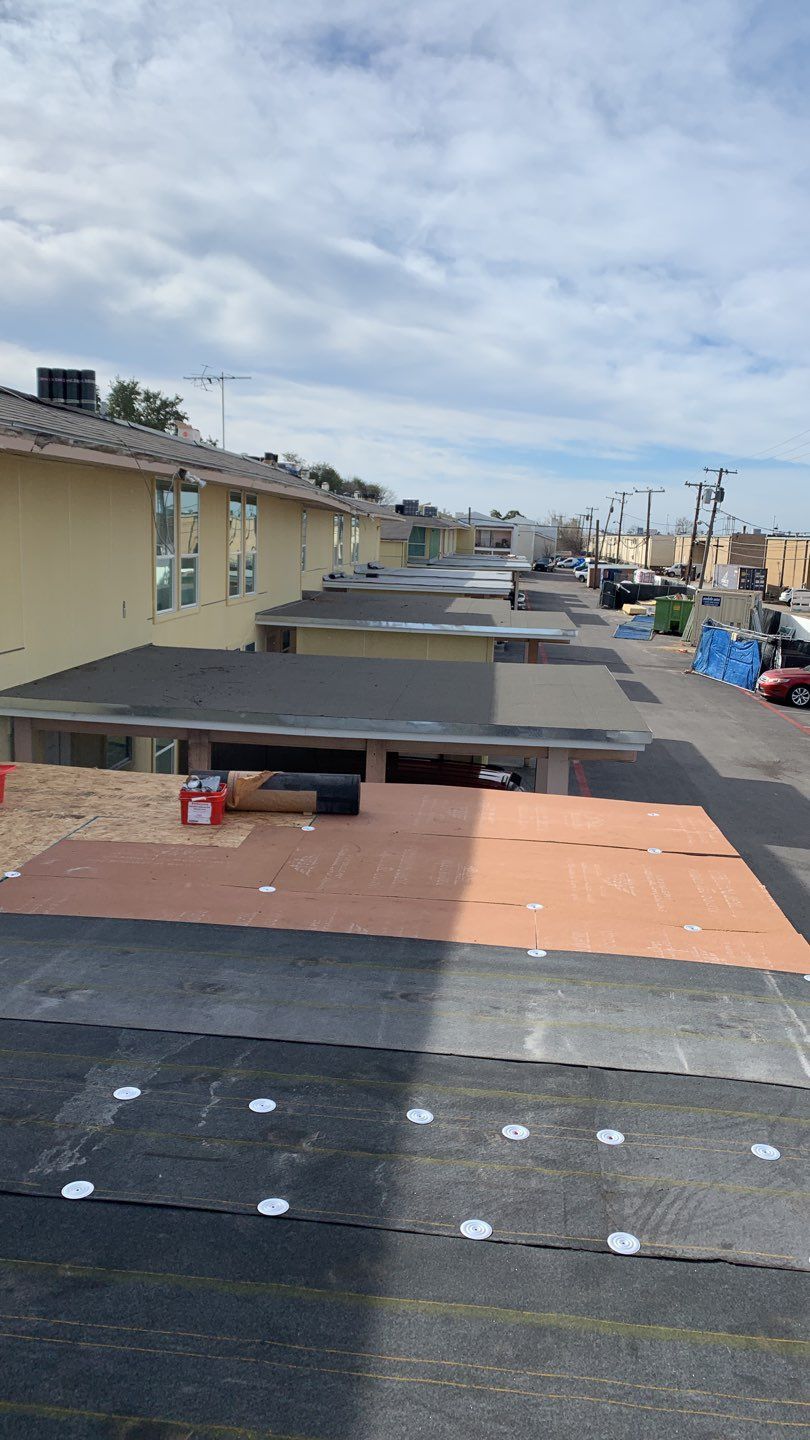 Apartment Roof Replacement by First Out Roofing 