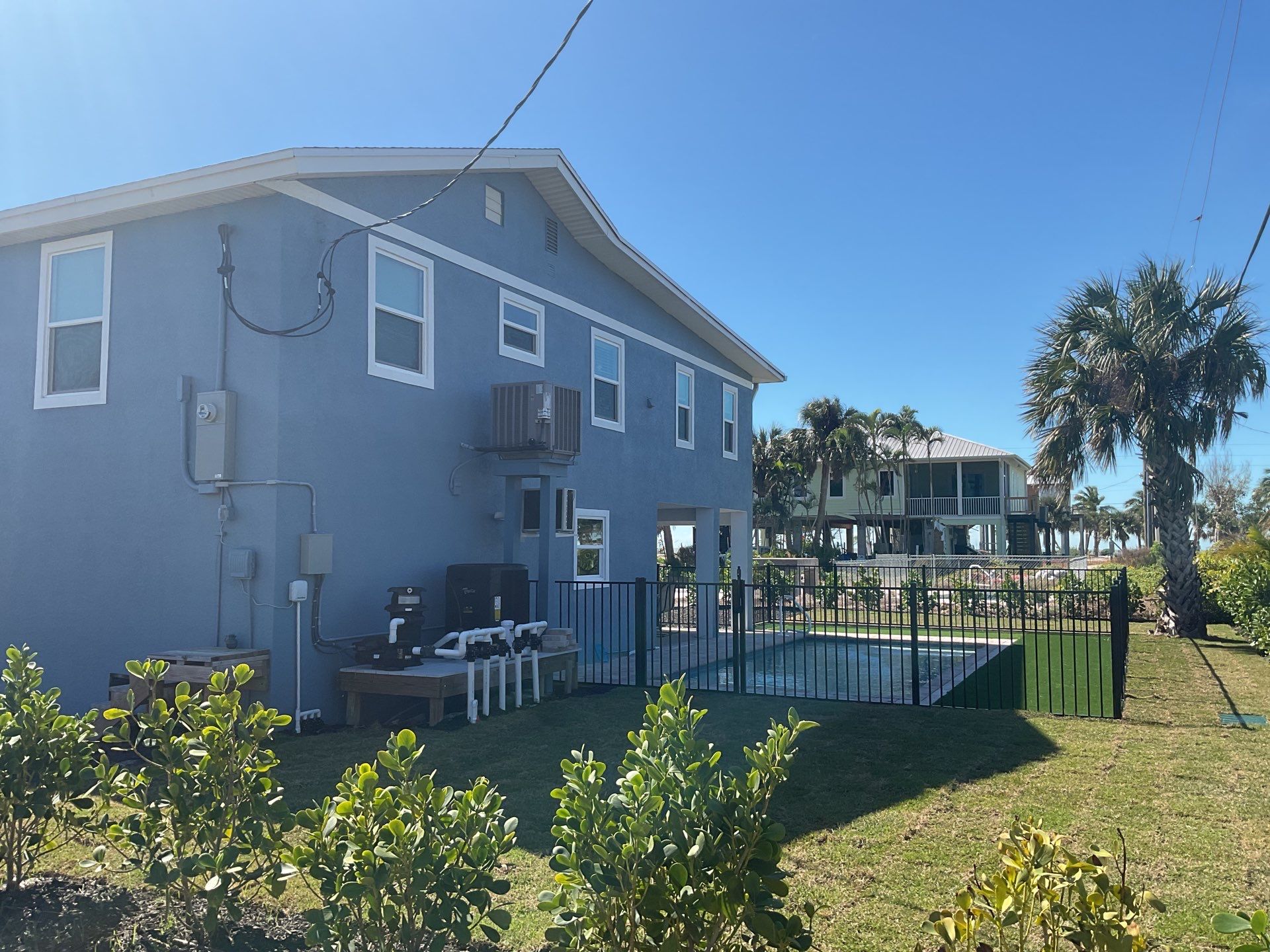 Downspout Installation for Two-Story Home in Fort Myers FL by Gutter Professor by Gutter Professors