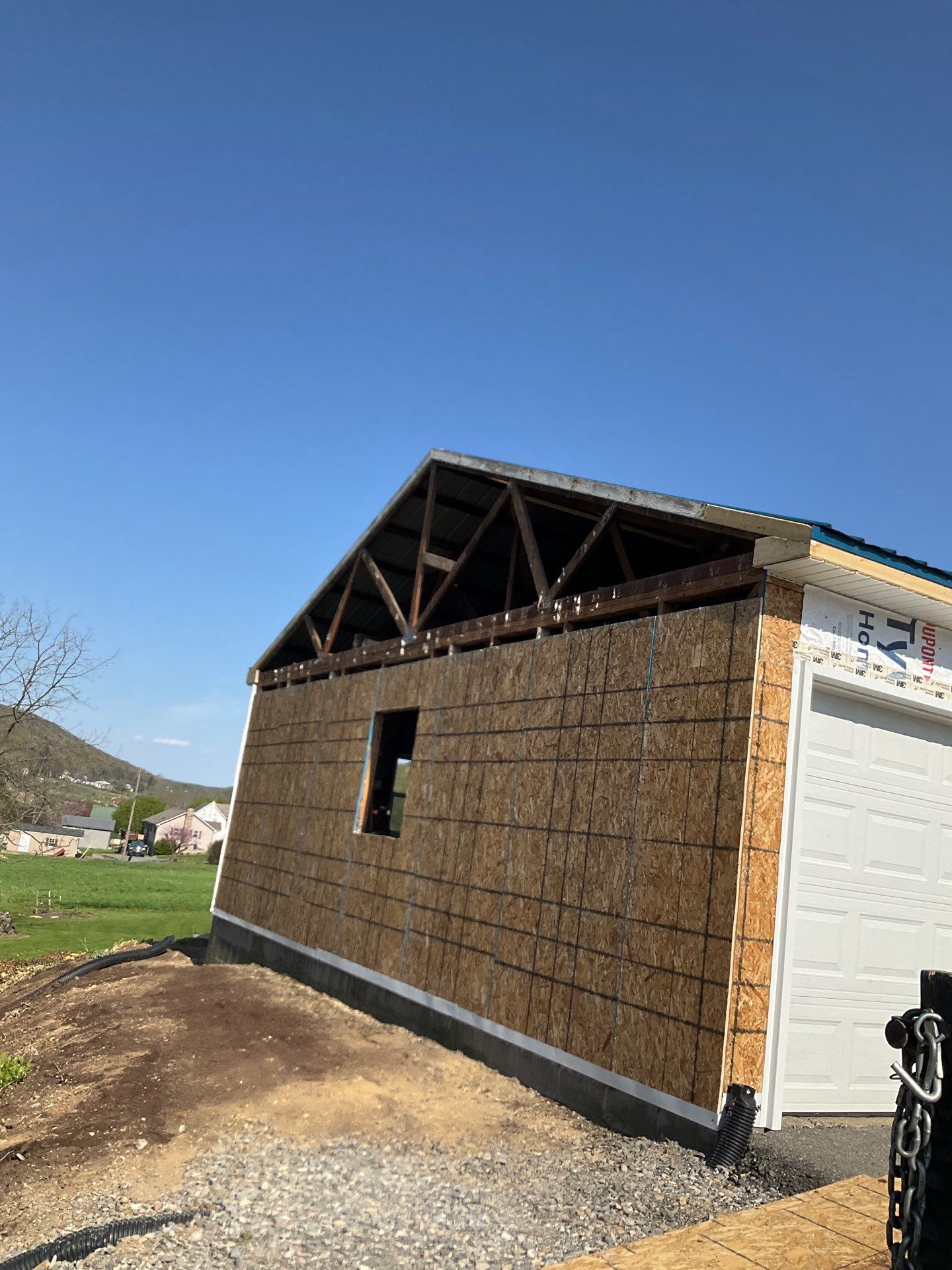 3-Car Garage refresh Blue Metal Roofing in Herndon by Esh Builders