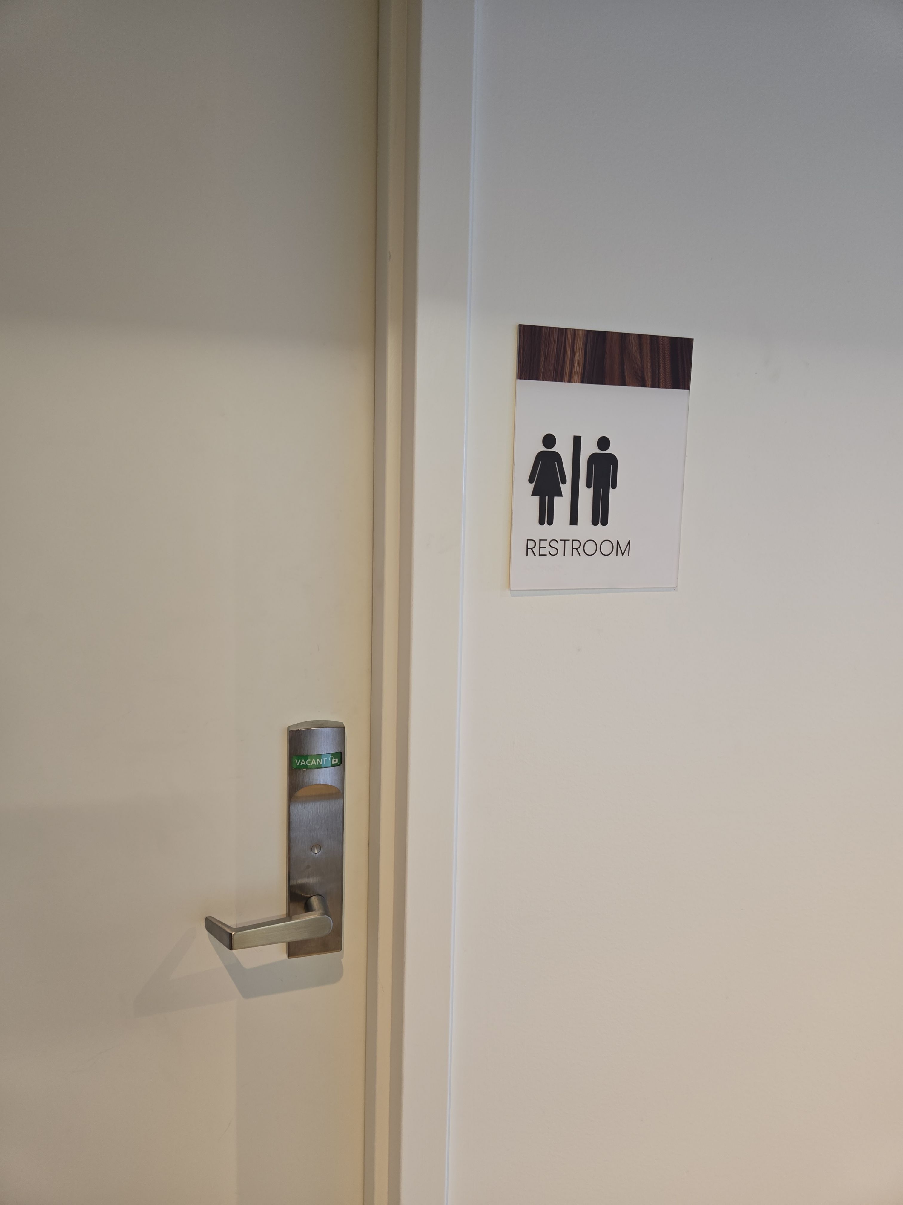 Interior ADA Restroom Signage with Wood Grain Accents by Hayes Design co