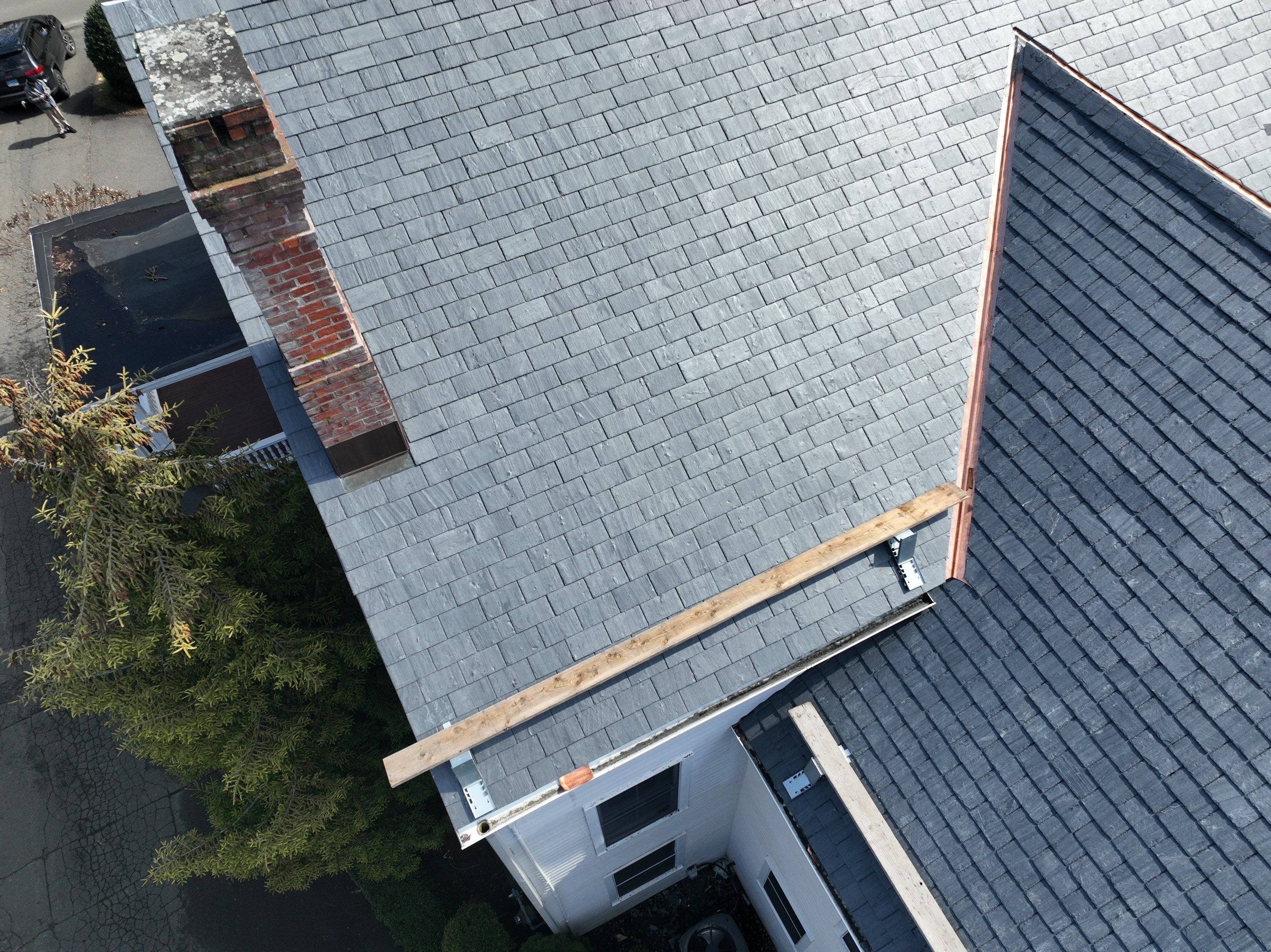 Residential Roofing Installation using Vermont Slate by A Plus Exterior